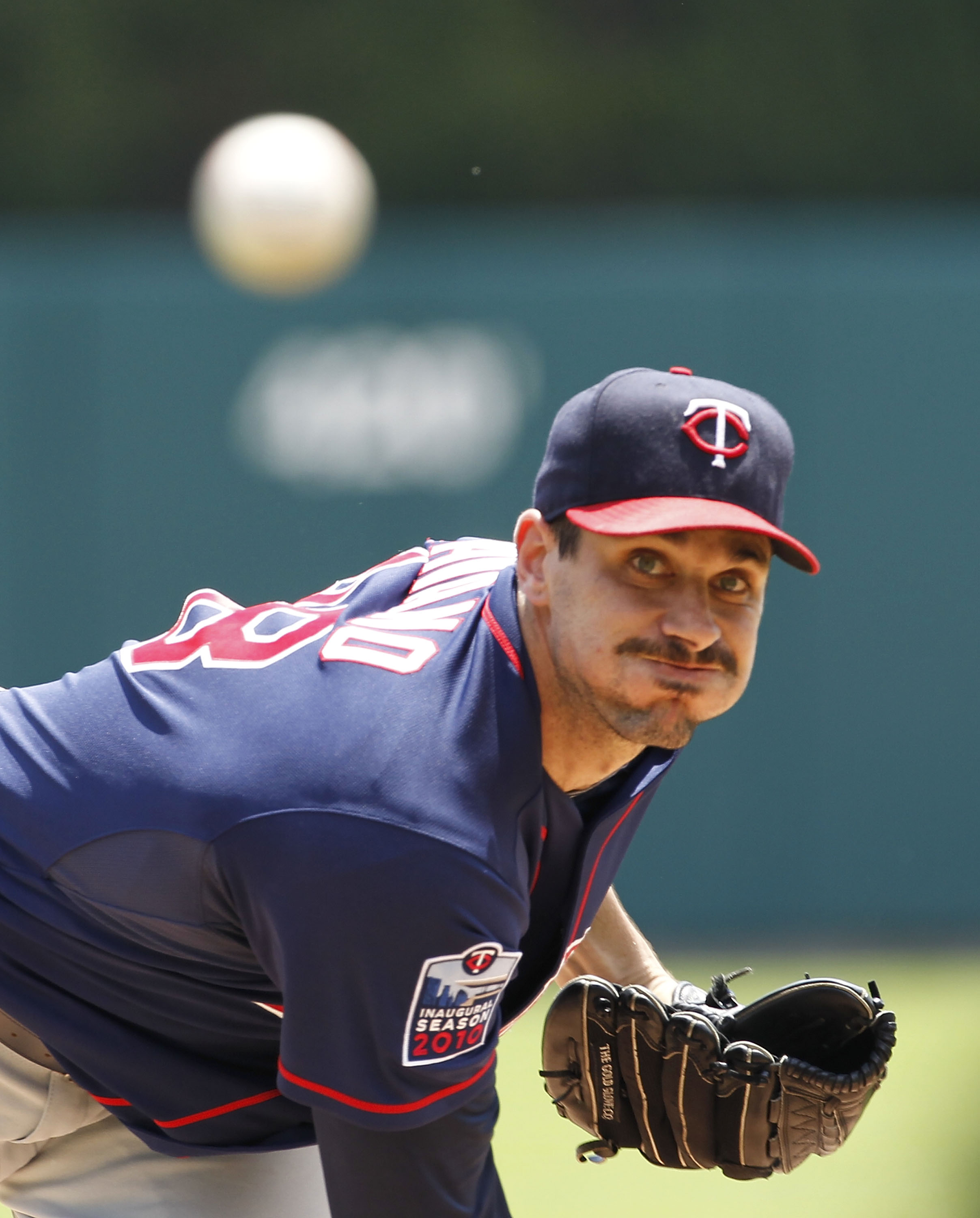 DETROIT - JULY 11:  Carl Pavano #48 of the Minnesota Twins warms up prior to the start of the game against the Detroit Tigers on July 11, 2010 at Comerica Park in Detroit, Michigan. The Twins defeated the Tigers 6-3. (Photo by Leon Halip/Getty Images)