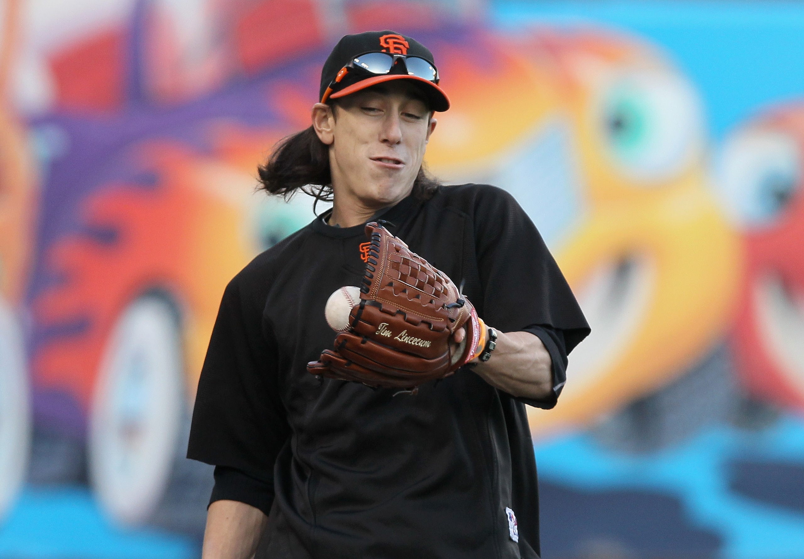 SAN FRANCISCO - OCTOBER 25:  Tim Lincecum #55 of the San Francisco Giants plays catch during a team workout at AT&T Park on October 25, 2010 in San Francisco, California. The Giants are preparing to face the Texas Rangers in the 2010 World Series.  (Photo