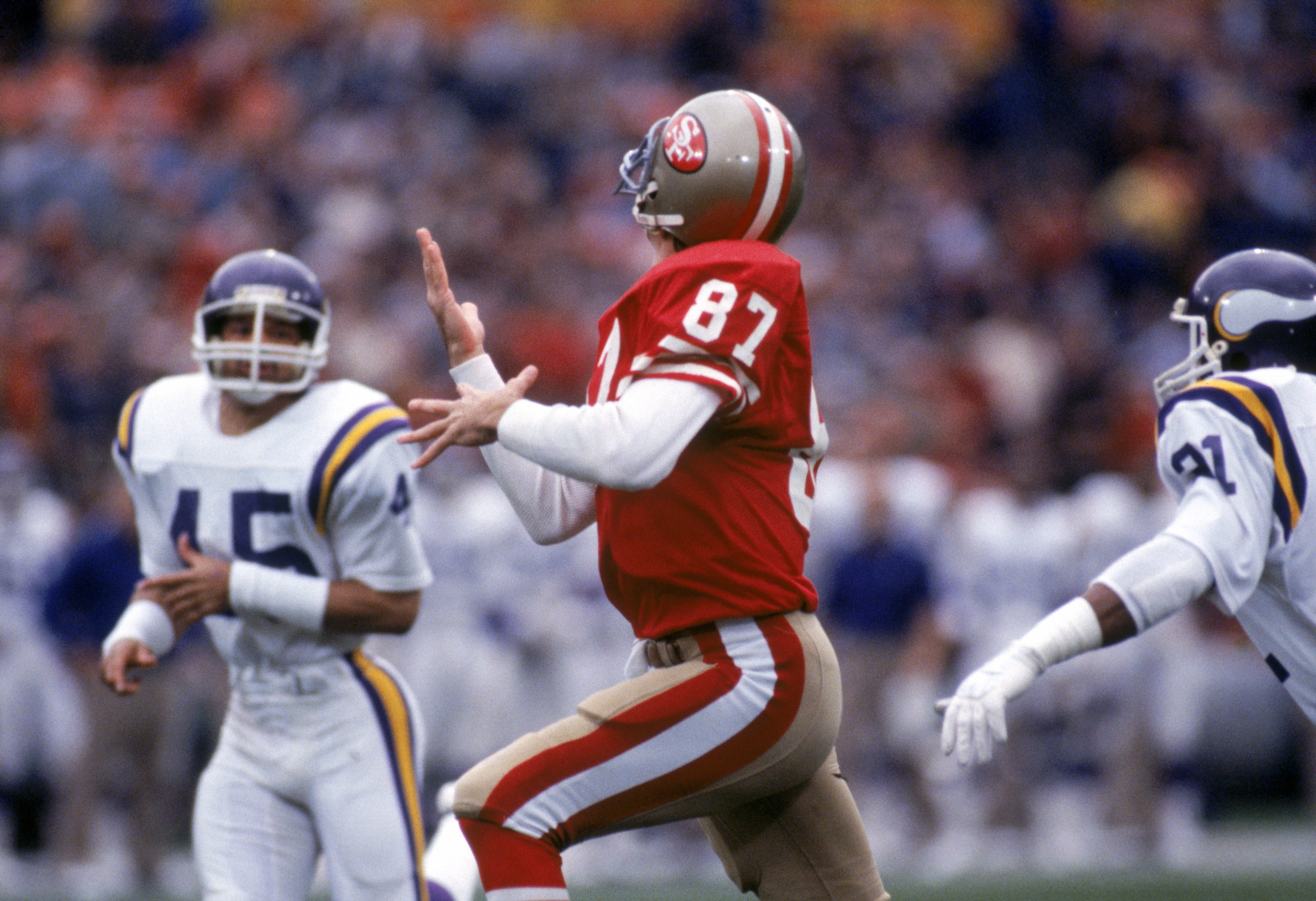 SAN FRANCISCO - DECEMBER 8:  Wide receiver Dwight Clark #87 of the San Francisco 49ers goes after a deep pass during a game against the Minnesota Vikings at Candlestick Park on December 8, 1984 in San Francisco, California.  The 49ers won 51-7.  (Photo by