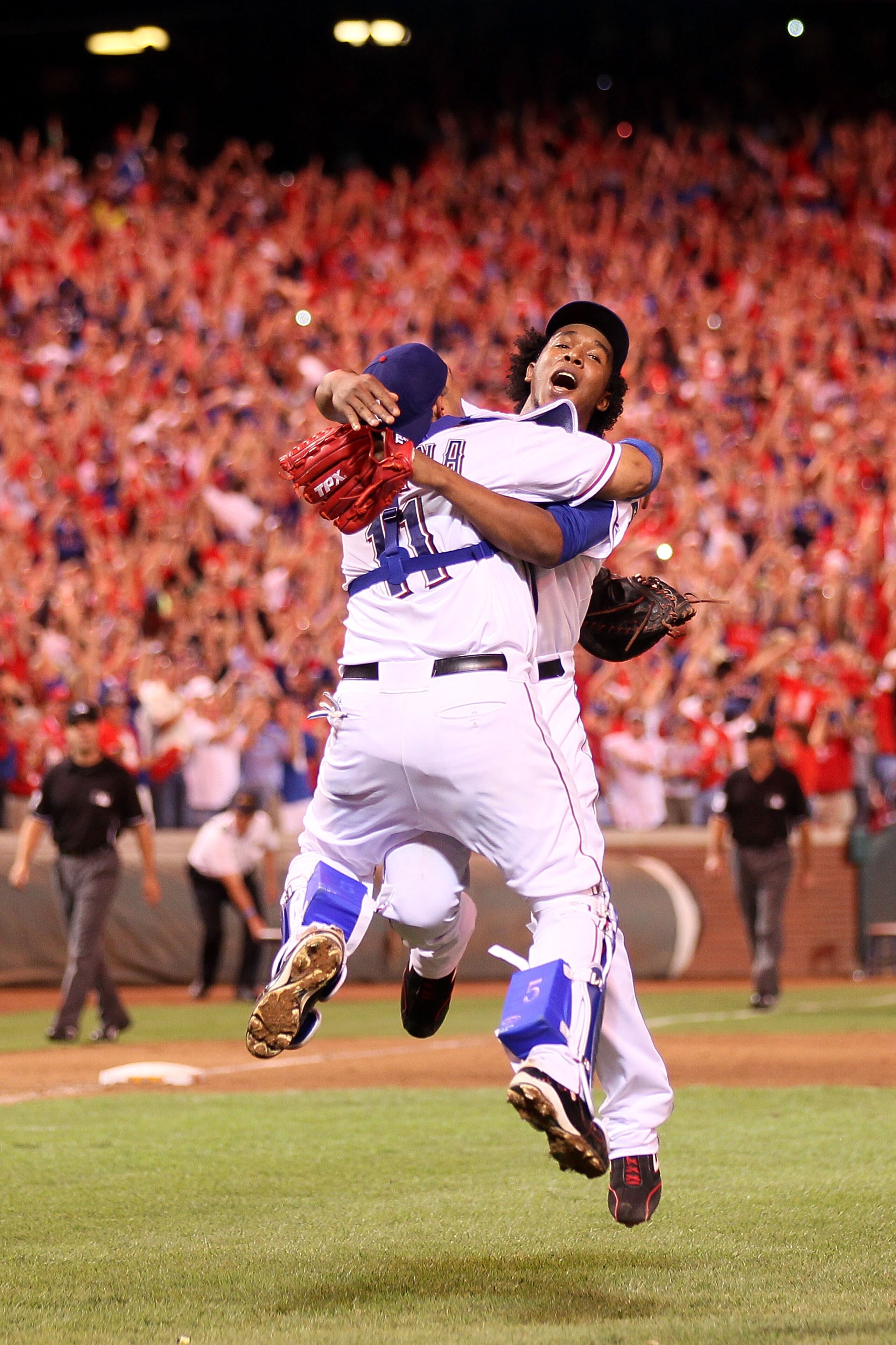 ARLINGTON, TX - OCTOBER 22:  Bengie Molina #11 and Neftali Feliz #30 of the Texas Rangers celebrate after defeating the New York Yankees 6-1 in Game Six of the ALCS to advance to the World Series during the 2010 MLB Playoffs at Rangers Ballpark in Arlingt