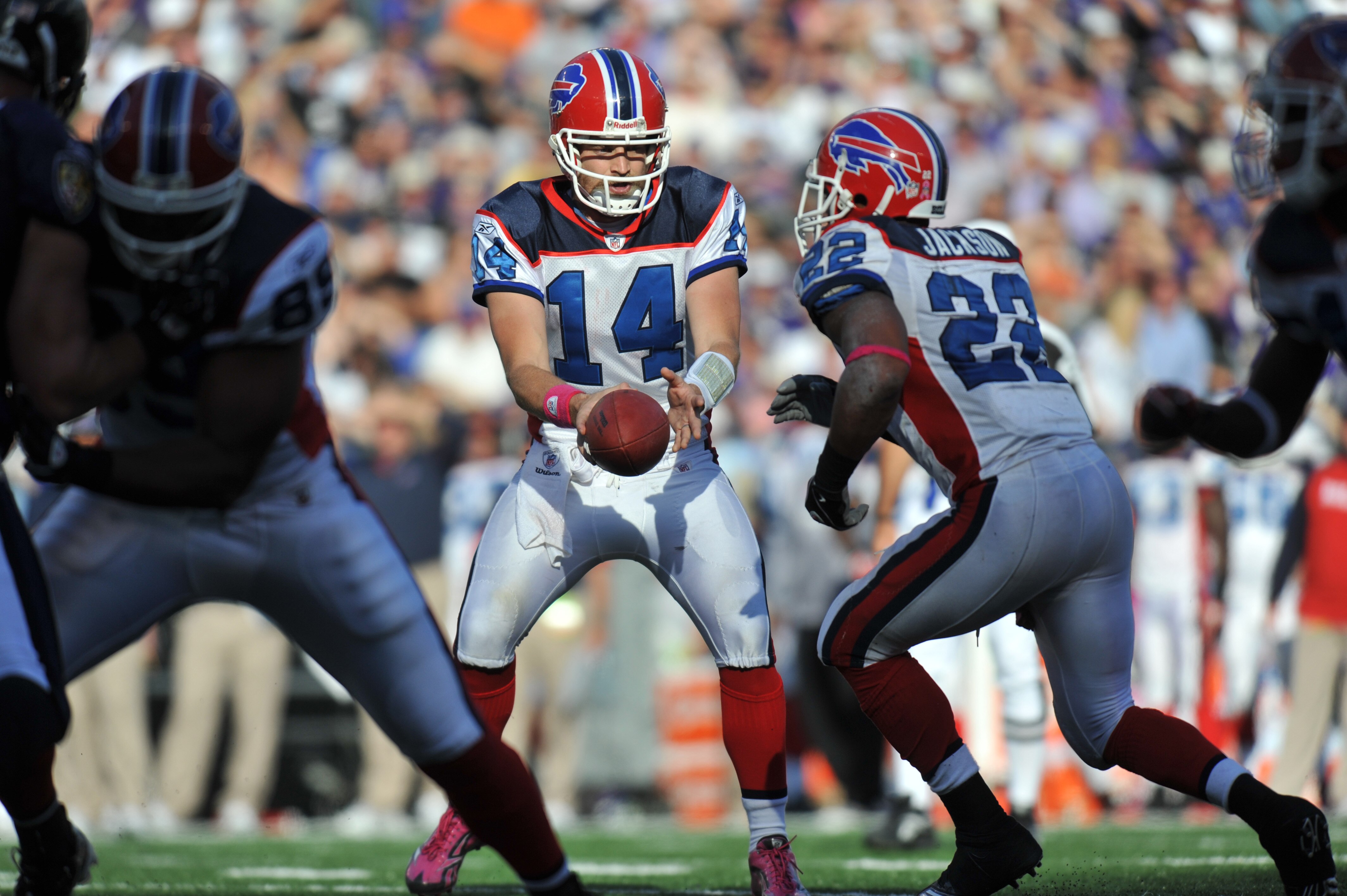 BALTIMORE, MD - OCTOBER 24:  Ryan Fitzpatrick #14 of the Buffalo Bills hands off to Fred Jackson #22 against the Baltimore Ravens at M&T Bank Stadium on October 24, 2010 in Baltimore, Maryland. The Ravens defeated the Bills 37-34. (Photo by Larry French/G