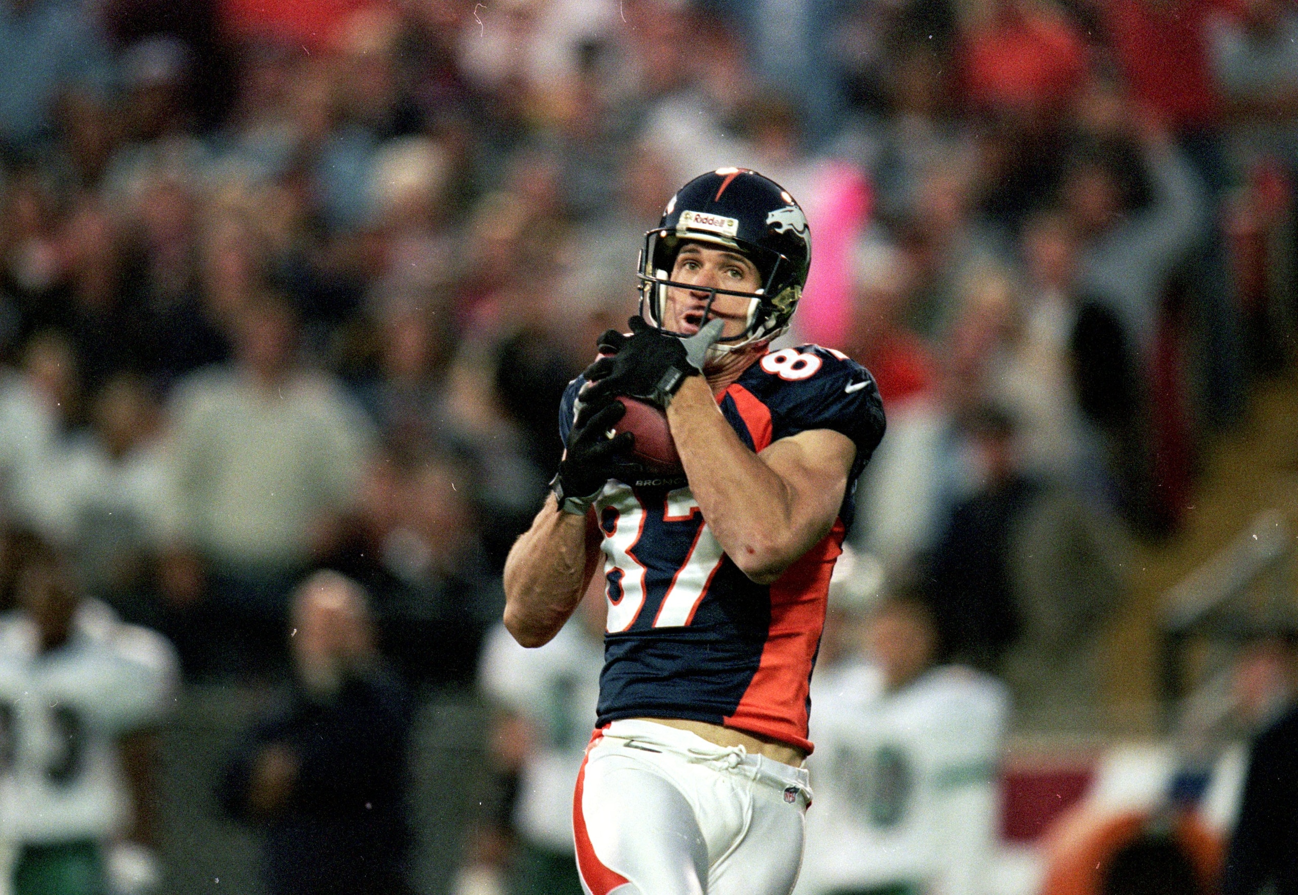 13 Sep 1999: Ed McCaffery #87 of the Denver Broncos carries the ball during a game against the Miami Dolphins at the Mile High Stadium in Denver, Colorado. The Dolphins defeated the Broncos 38-21. Mandatory Credit: Brian Bahr  /Allsport