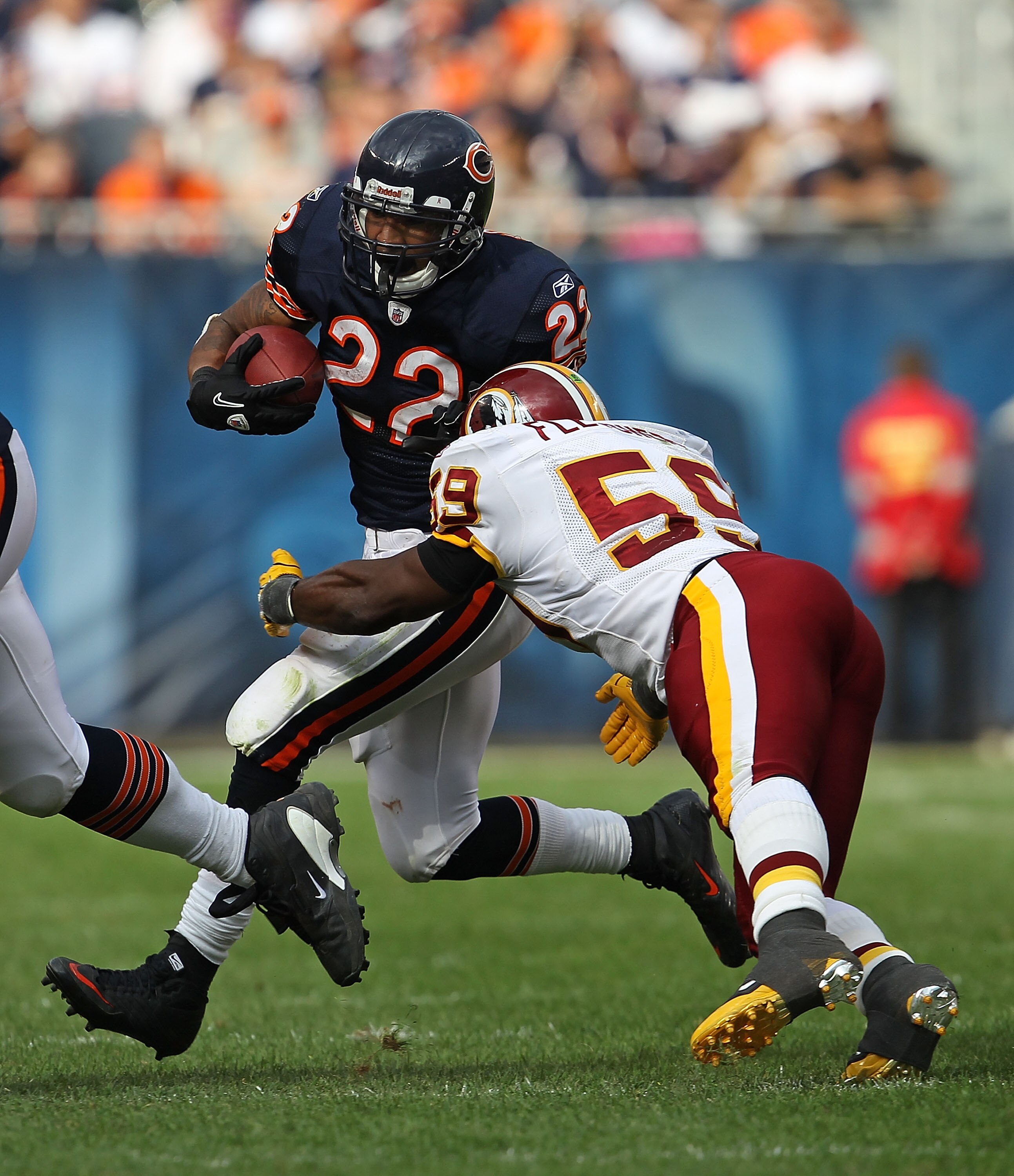 CHICAGO - OCTOBER 24: Matt Forte #22 of the Chicago Bears avoids a tackle attempt by London Fletcher #59 of the Washington Redskins at Soldier Field on October 24, 2010 in Chicago, Illinois. The Redskins defeated the Bears 17-14. (Photo by Jonathan Daniel