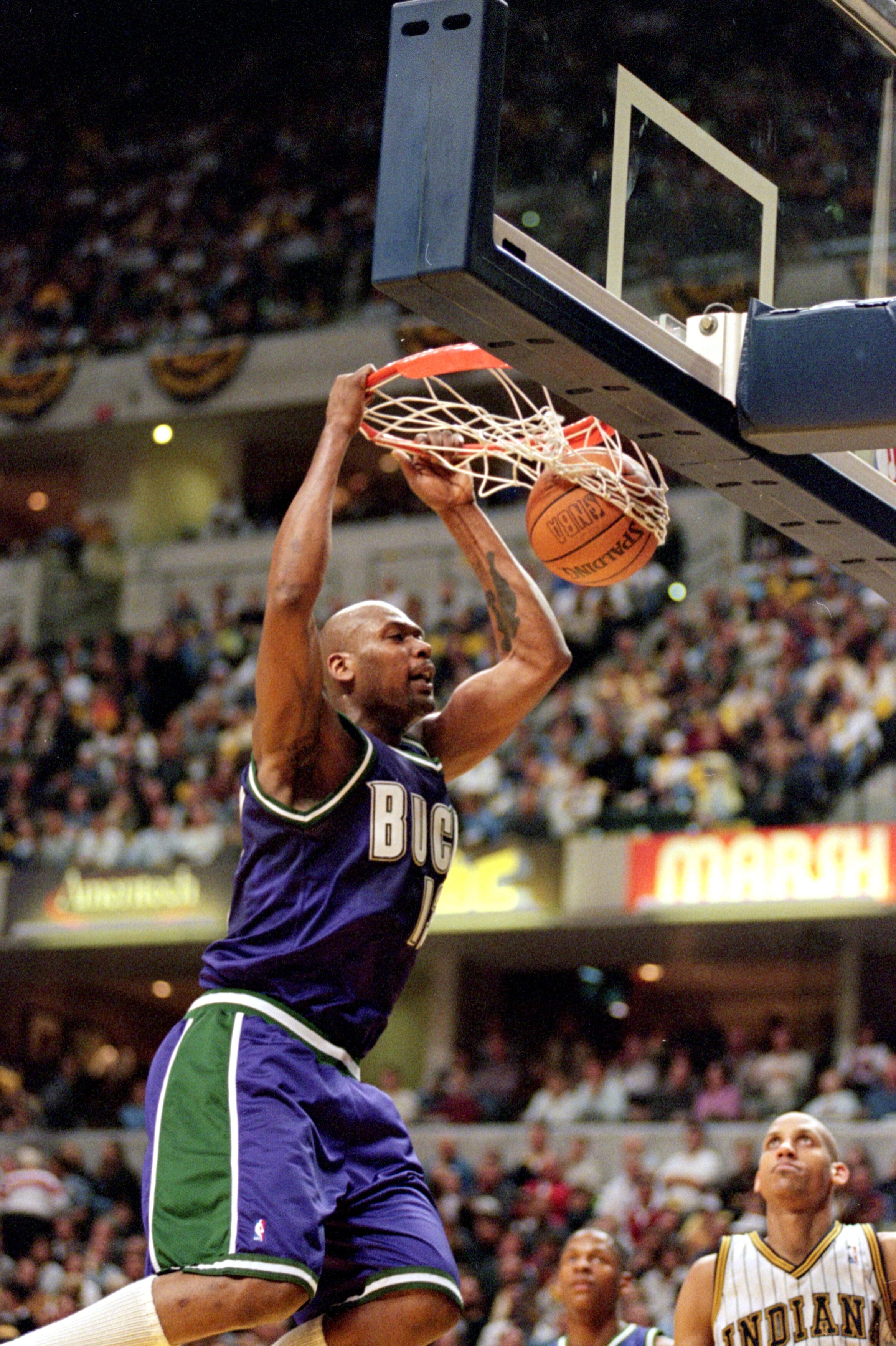 23 Apr 2000: Glenn Robinson #13 of the Milwaukee Bucks makes a slam dunk during the NBA Eastern Conference Playoffs Round One Game against the Indiana Pacers at the Conseco Fieldhouse in Indianapolis, Indiana. The Pacers defeated the Bucks 88-85..   Manda