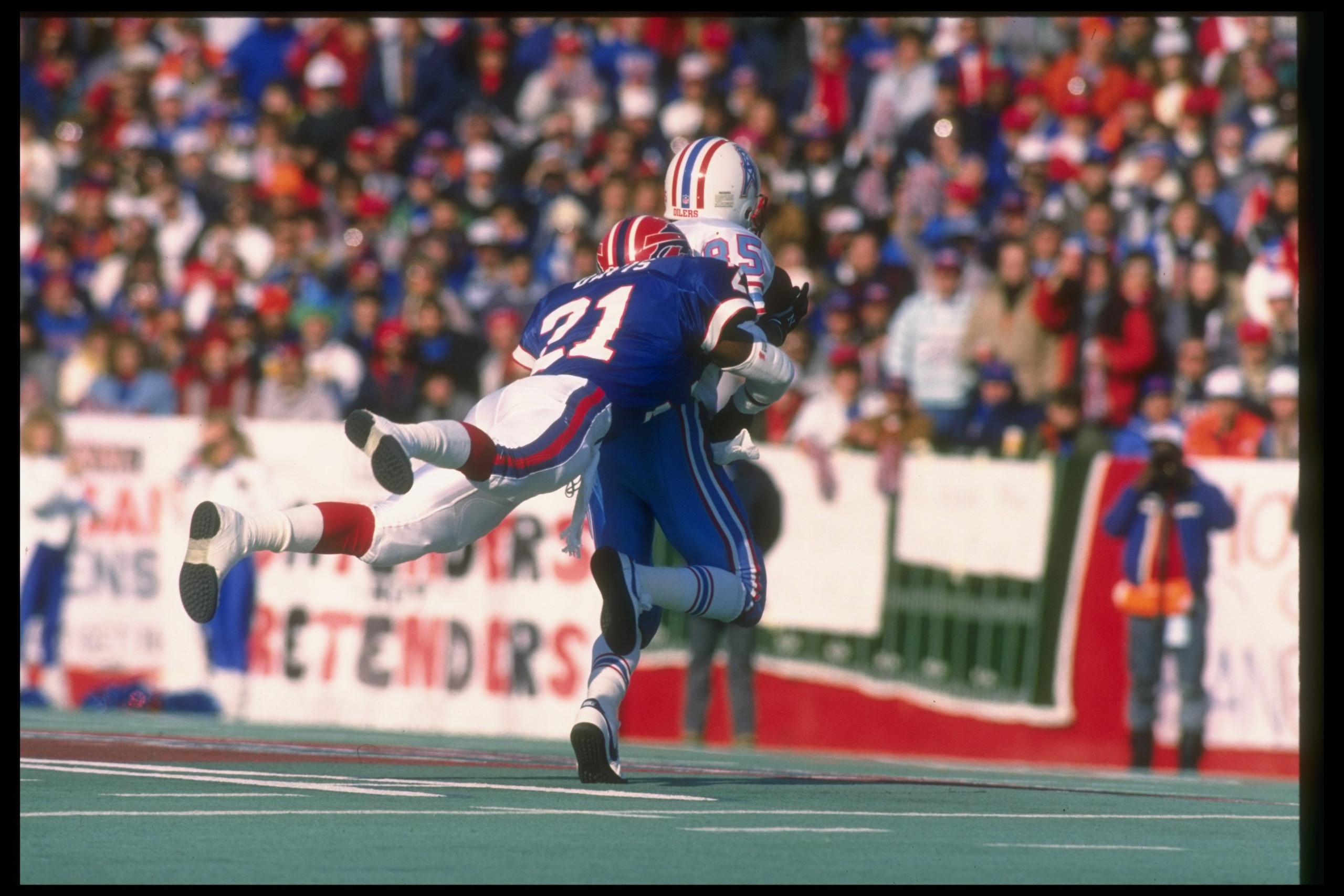 1 Jan 1989:  Defensive back Wayne Davis of the Buffalo Bills (left) tackles Houston Oilers wide receiver Drew Hill during a playoff game at Rich Stadium in Orchard Park, New York.  The Bills won the game, 17-10. Mandatory Credit: Rick Stewart  /Allsport