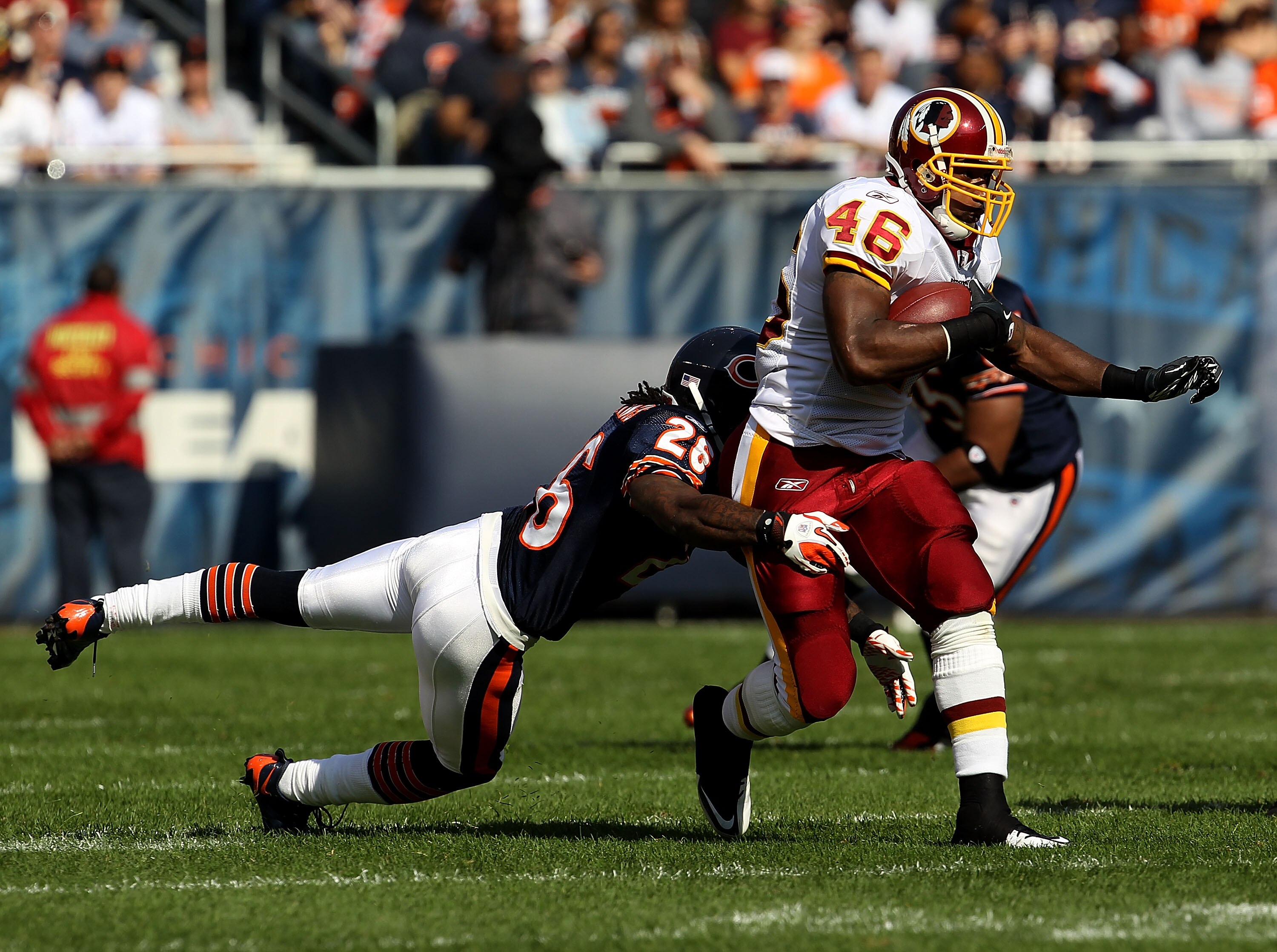 CHICAGO - OCTOBER 24: Ryan Torain #46 of the Washington Redskins runs past Tim Jennings #26 of the Chicago Bears at Soldier Field on October 24, 2010 in Chicago, Illinois. The Redskins defeated the Bears 17-14. (Photo by Jonathan Daniel/Getty Images)