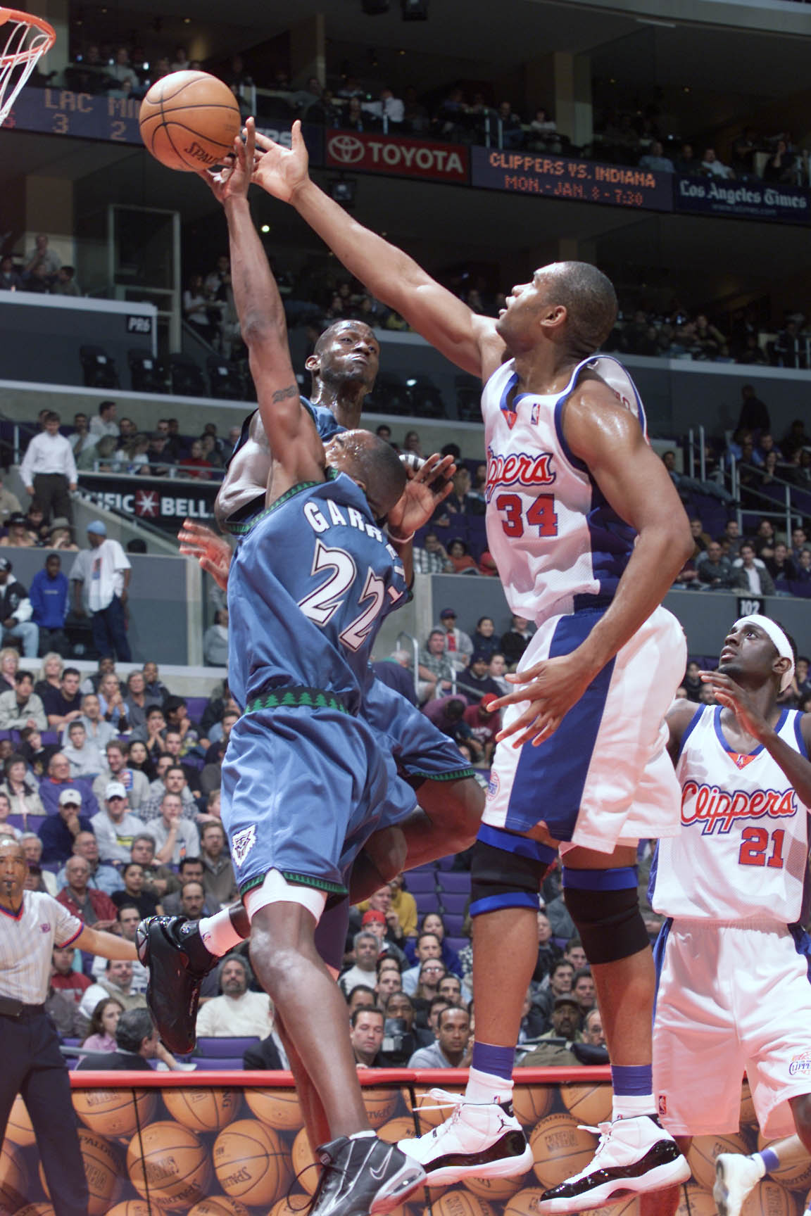 20 Dec 2000:  Dean Garrett #22 of the Minnesota Timberwolves blocks an offensive rebound by Michael Olowakandi #34 of the Los Angeles Clippersat the Staples Center in Los Angeles, California.  The Clippers defeated the Timberwolves 103-96.   DIGITAL IMAGE