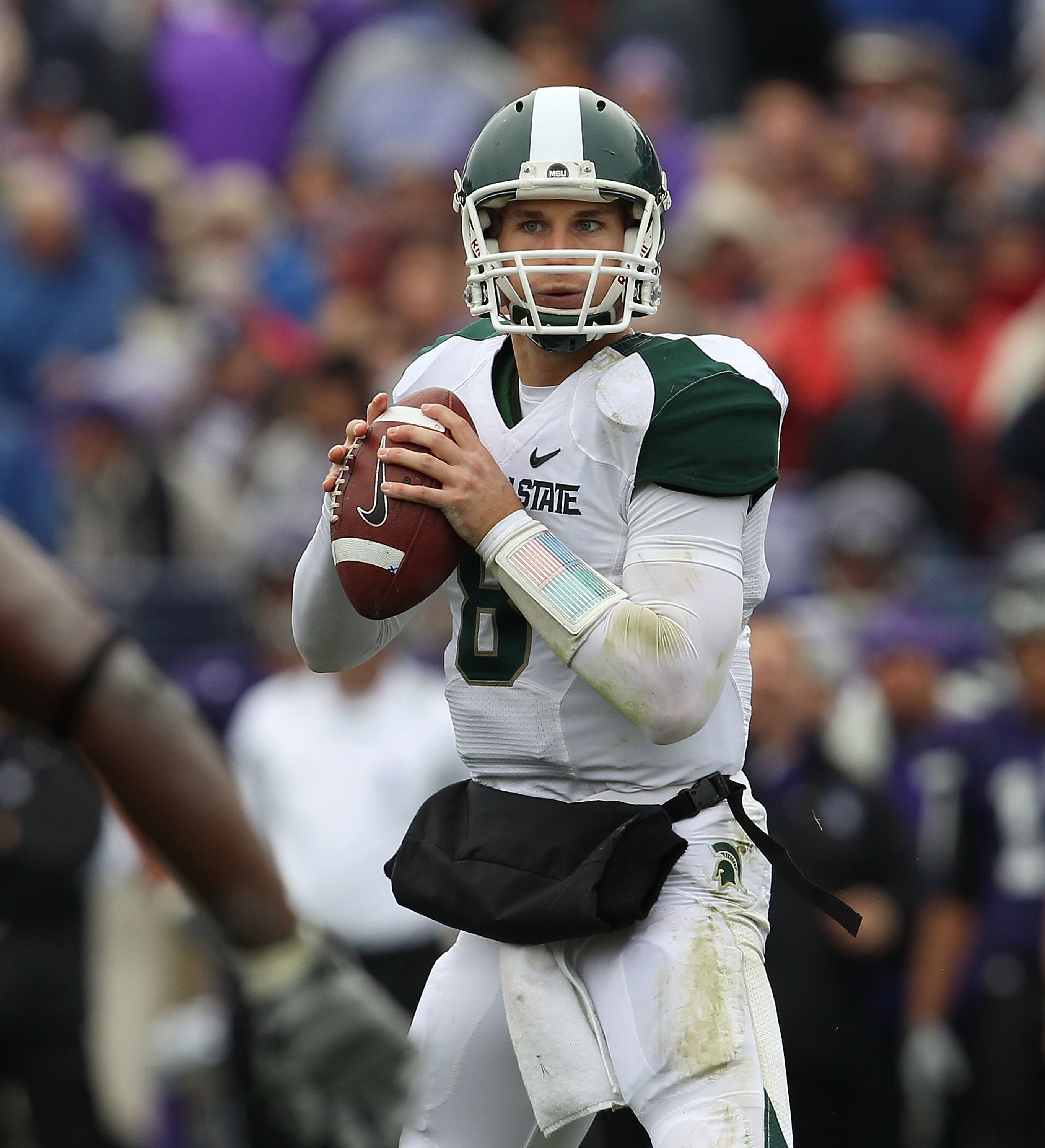 EVANSTON, IL - OCTOBER 23: Kirk Cousins #8 of the Michigan State Spartans looks for a receiver against the Northwestern Wildcats at Ryan Field on October 23, 2010 in Evanston, Illinois. Michigan State defeated Northwestern 35-27. (Photo by Jonathan Daniel