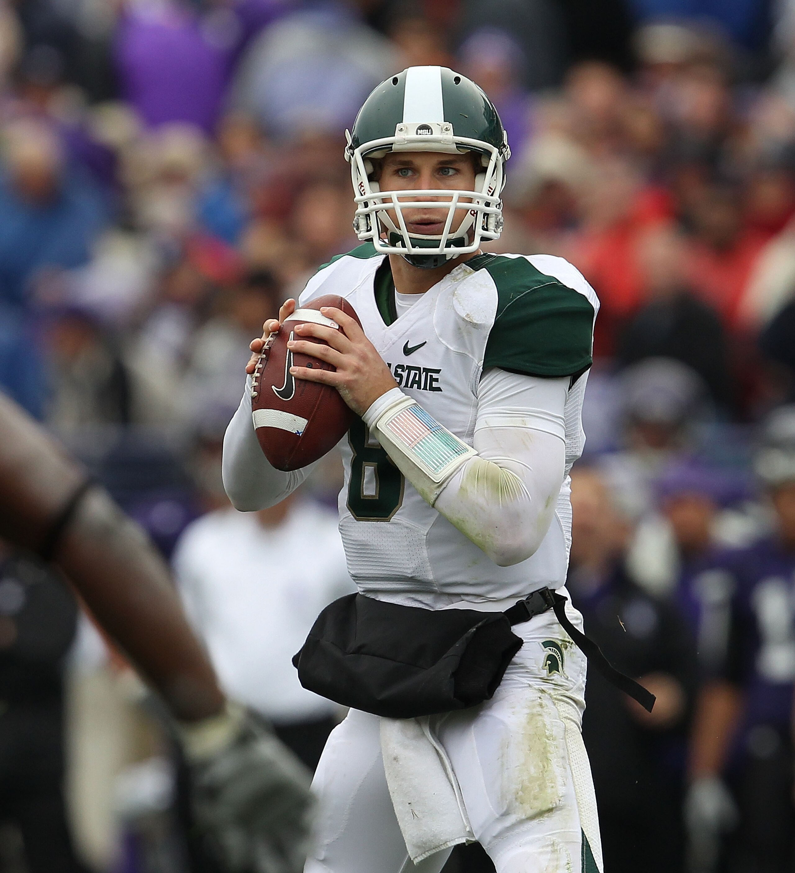 EVANSTON, IL - OCTOBER 23: Kirk Cousins #8 of the Michigan State Spartans looks for a receiver against the Northwestern Wildcats at Ryan Field on October 23, 2010 in Evanston, Illinois. Michigan State defeated Northwestern 35-27. (Photo by Jonathan Daniel