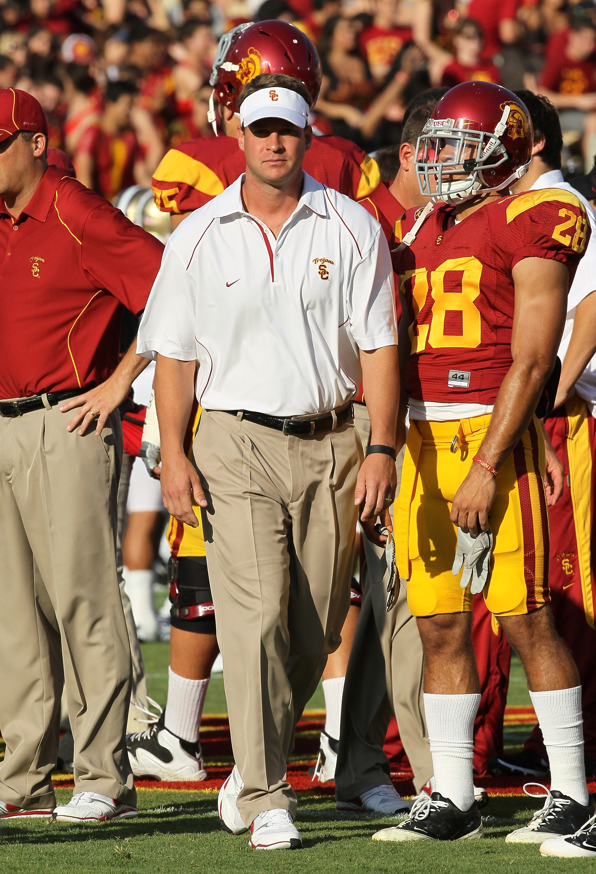 LOS ANGELES - OCTOBER 2:  Head coach Lane Kiffin of the USC Trojans watches pregame warmups before the game with the Washington Huskies at the Los Angeles Memorial Coliseum on October 2, 2010 in Los Angeles, California.    (Photo by Stephen Dunn/Getty Ima