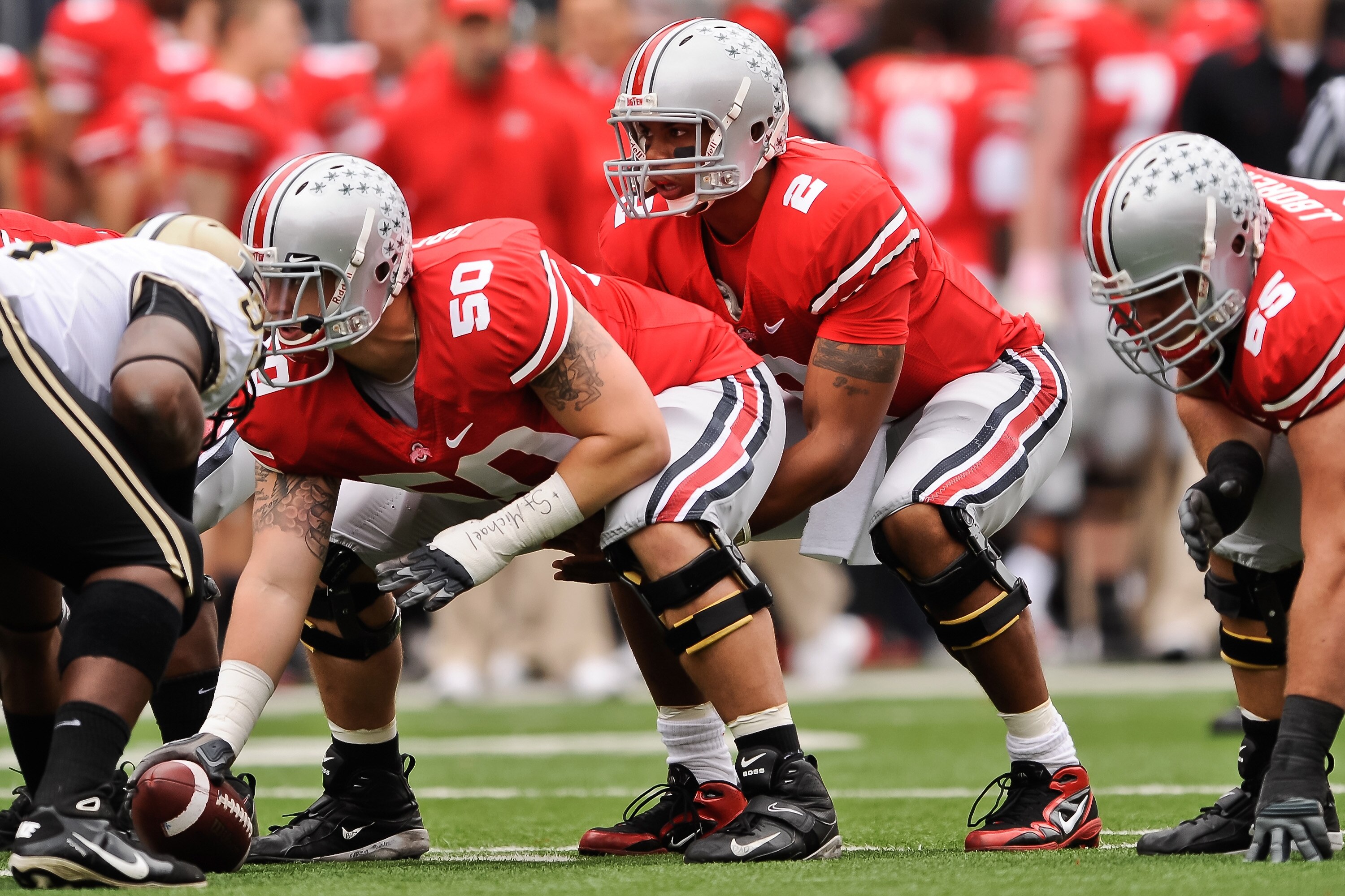 COLUMBUS, OH - OCTOBER 23:  Michael Brewster #50 of the Ohio State Buckeyes prepares to snap the ball to quarterback Terrelle Pryor #2 of the Ohio State Buckeyes against the Purdue Boilermakers at Ohio Stadium on October 23, 2010 in Columbus, Ohio.  (Phot