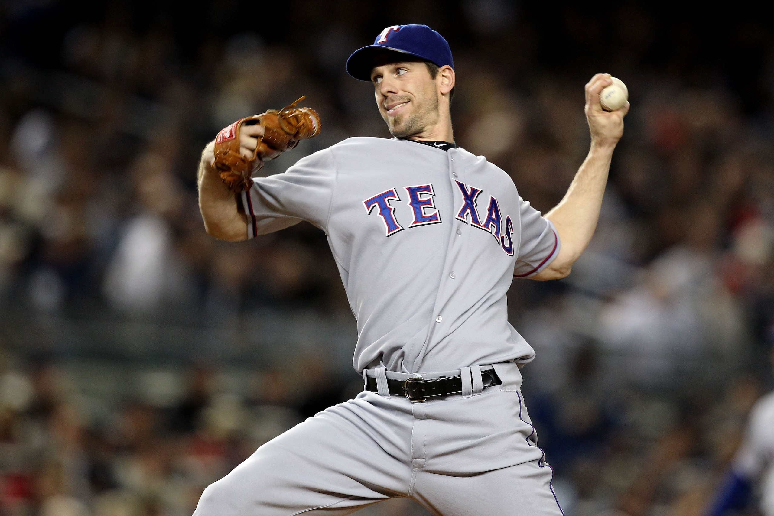 NEW YORK - OCTOBER 18:  Cliff Lee #33 of the Texas Rangers throws a pitch against the New York Yankees in Game Three of the ALCS during the 2010 MLB Playoffs at Yankee Stadium on October 18, 2010 in New York, New York. The Rangers won 8-0.  (Photo by Al B