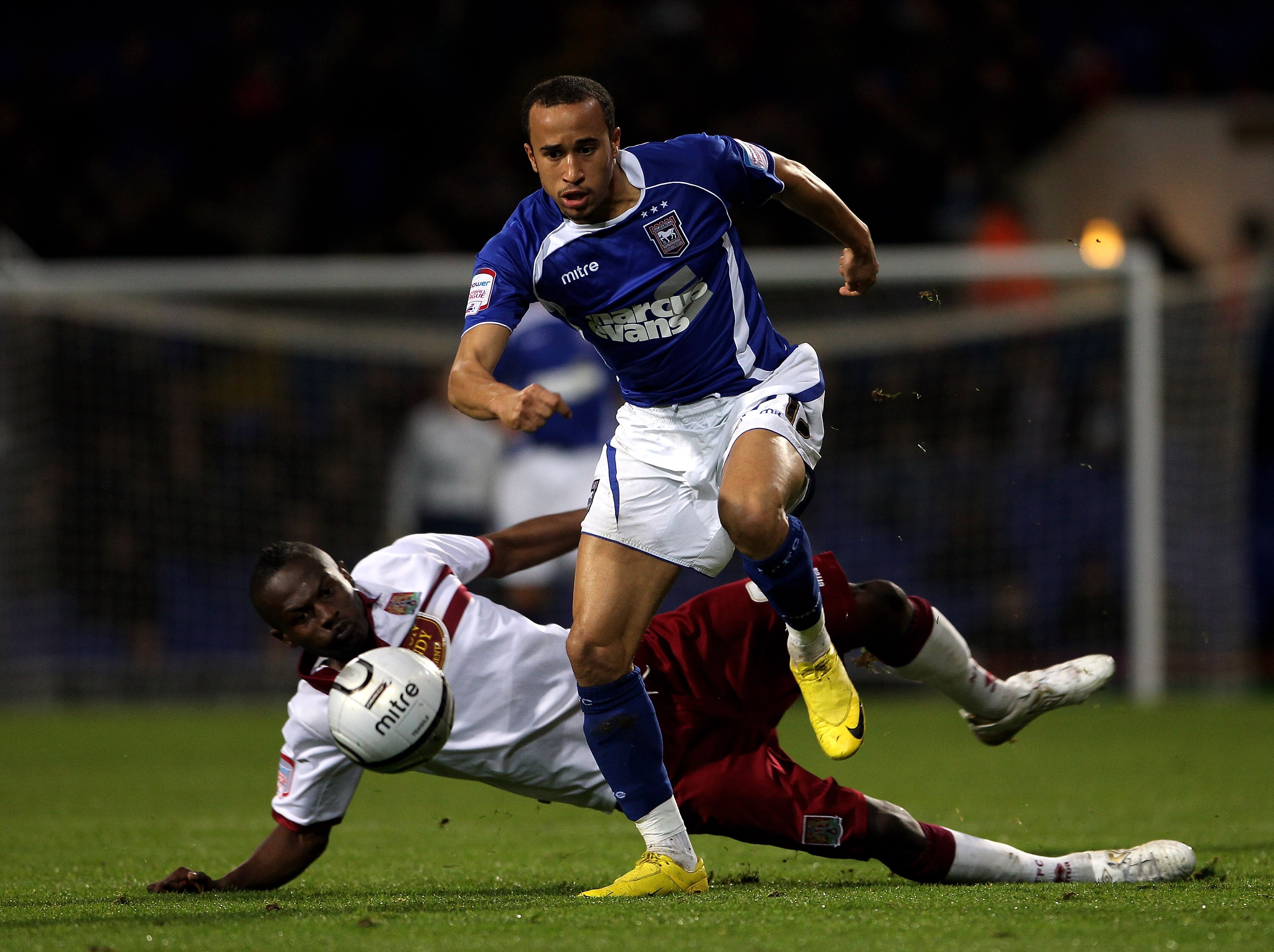 IPSWICH, ENGLAND - OCTOBER 26:  Andros Townsend of Ipswich Town moves away from Abdul Osman during the Carling Cup fourth round match between Ipswich Town and Northampton Town at Portman Road on October 26, 2010 in Ipswich, England.  (Photo by David Roger