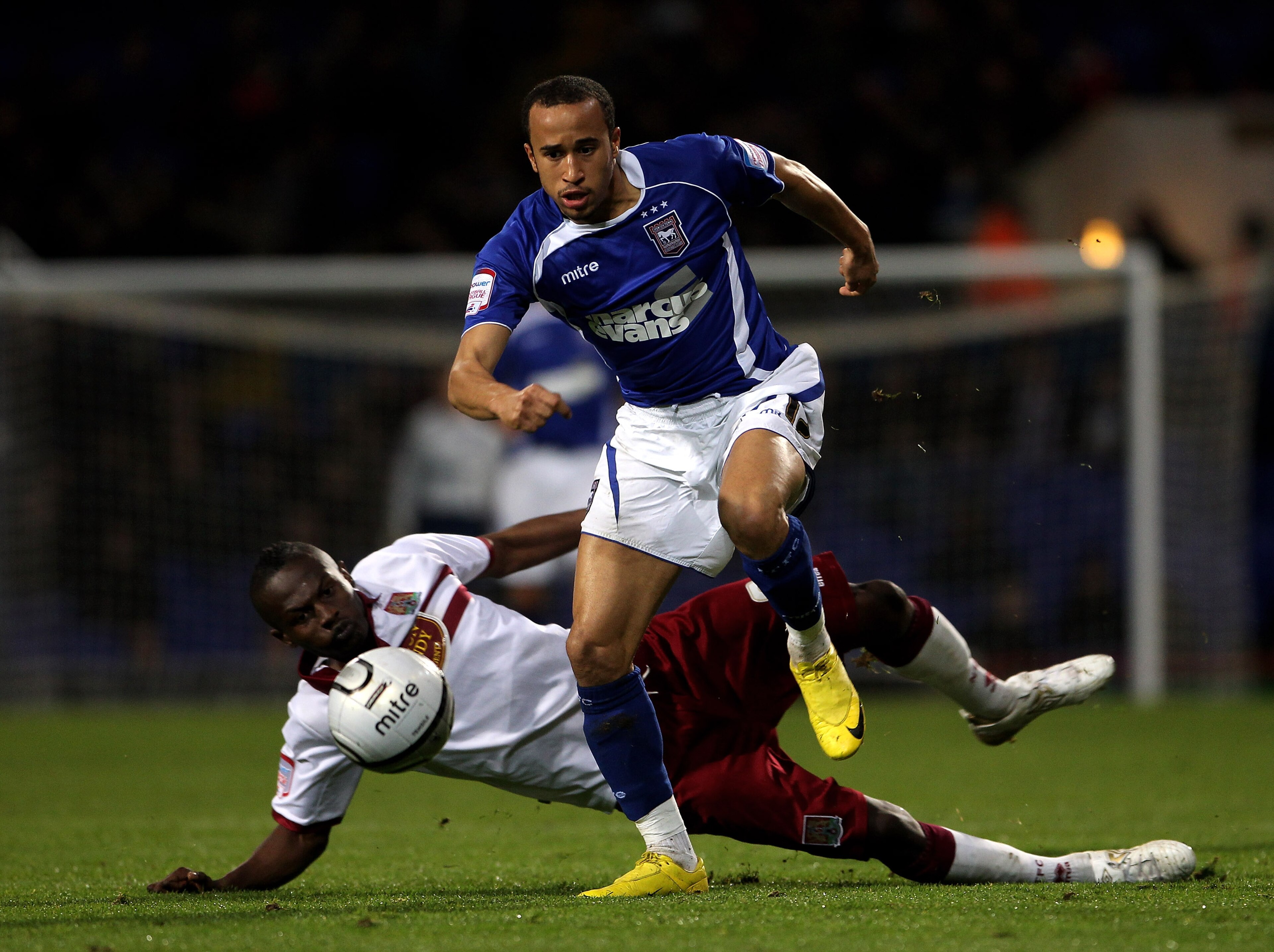 IPSWICH, ENGLAND - OCTOBER 26:  Andros Townsend of Ipswich Town moves away from Abdul Osman during the Carling Cup fourth round match between Ipswich Town and Northampton Town at Portman Road on October 26, 2010 in Ipswich, England.  (Photo by David Roger
