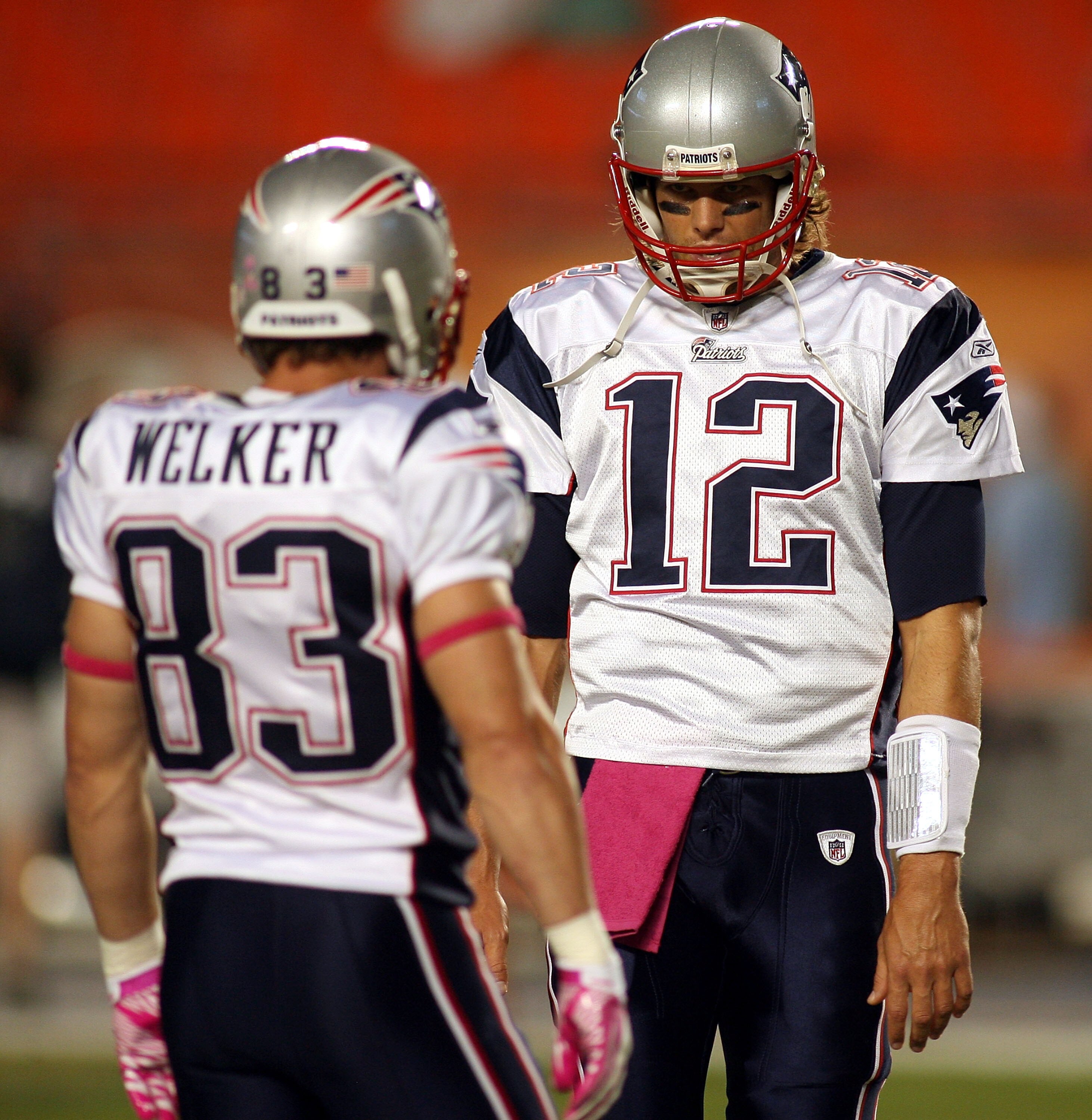 MIAMI - OCTOBER 04:  Quarterback Tom Brady #12 of the New England Patriots with Reciever Wes Welker #83 during warm ups against the Miami Dolphins at Sun Life Stadium on October 4, 2010 in Miami, Florida.  (Photo by Marc Serota/Getty Images)