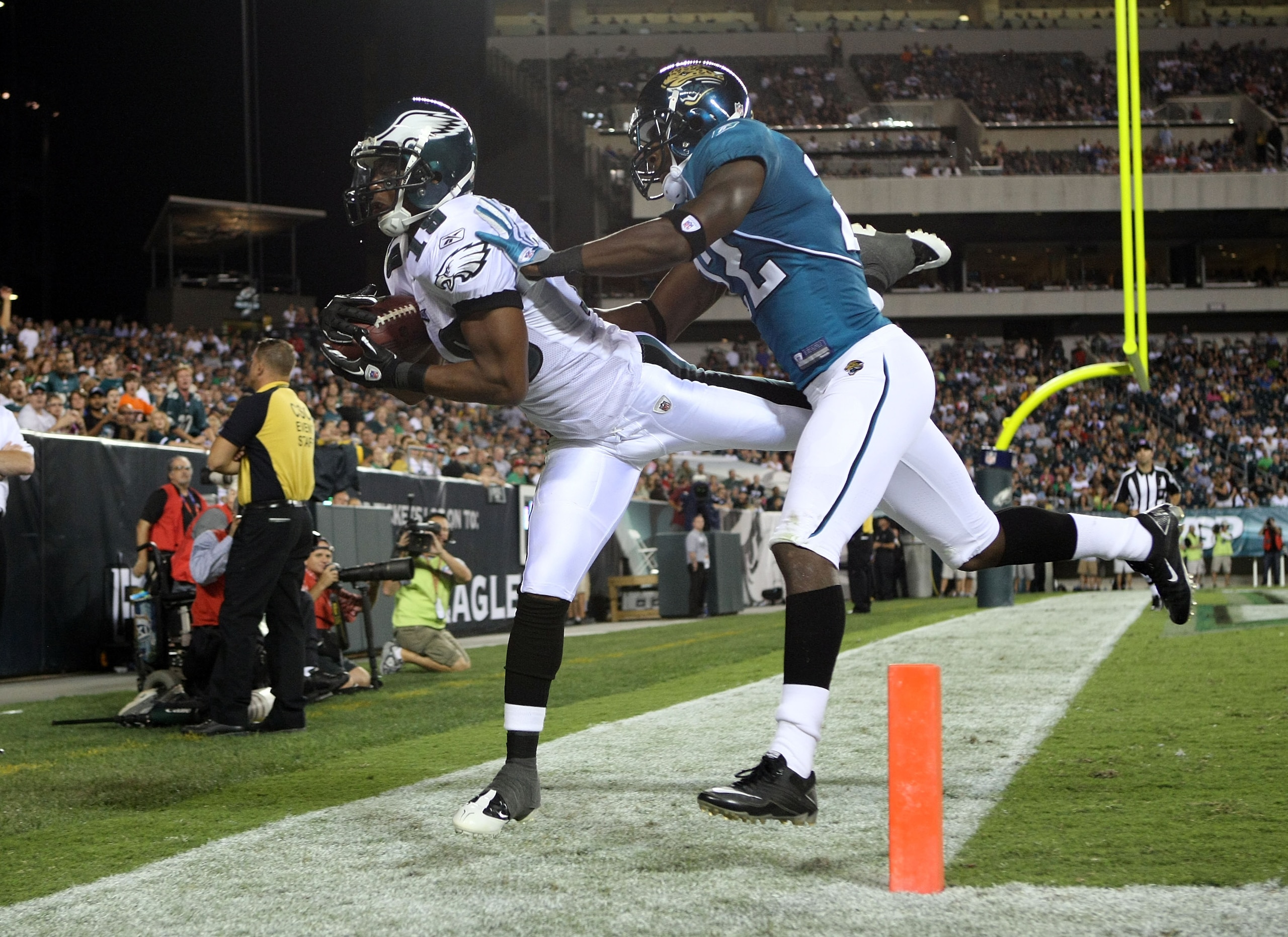 PHILADELPHIA - AUGUST 13:  Jordan Norwood #19 of the Philadelphia Eagles fails to hold onto a pass in the endzone under pressure from Don Carey #22 of the Jacksonville Jaguars during their preseason game at Lincoln Financial Field on August 13, 2010 in Ph
