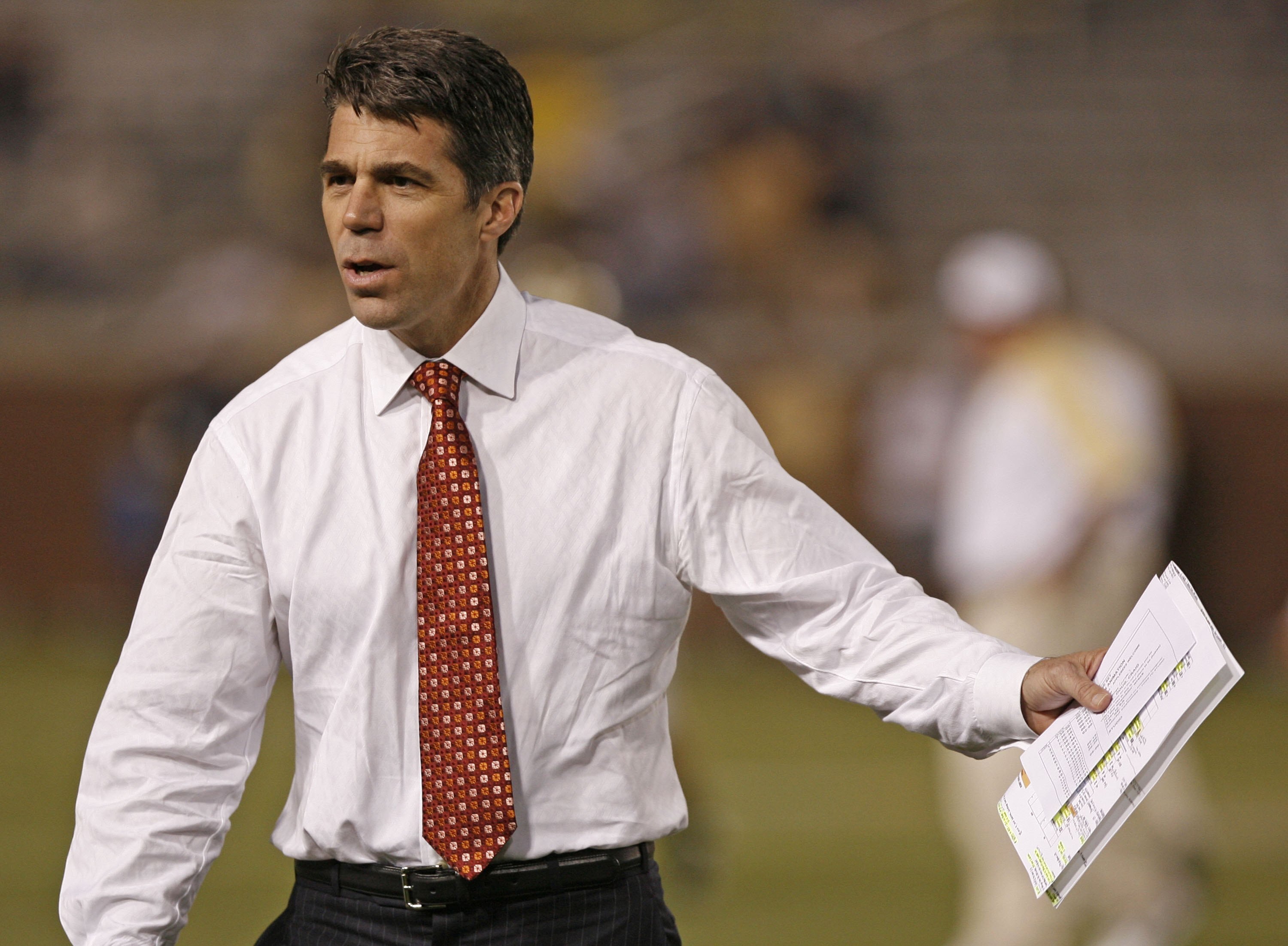 ATLANTA - NOVEMBER 1: ESPN commentator Chris Fowler talks with coaches before the game between the Georgia Tech Yellow Jackets and the Virginia Tech Hokies on November 1, 2007 at Bobby Dodd Stadium at Historic Grant Field in Atlanta, Georgia.  The Hokies