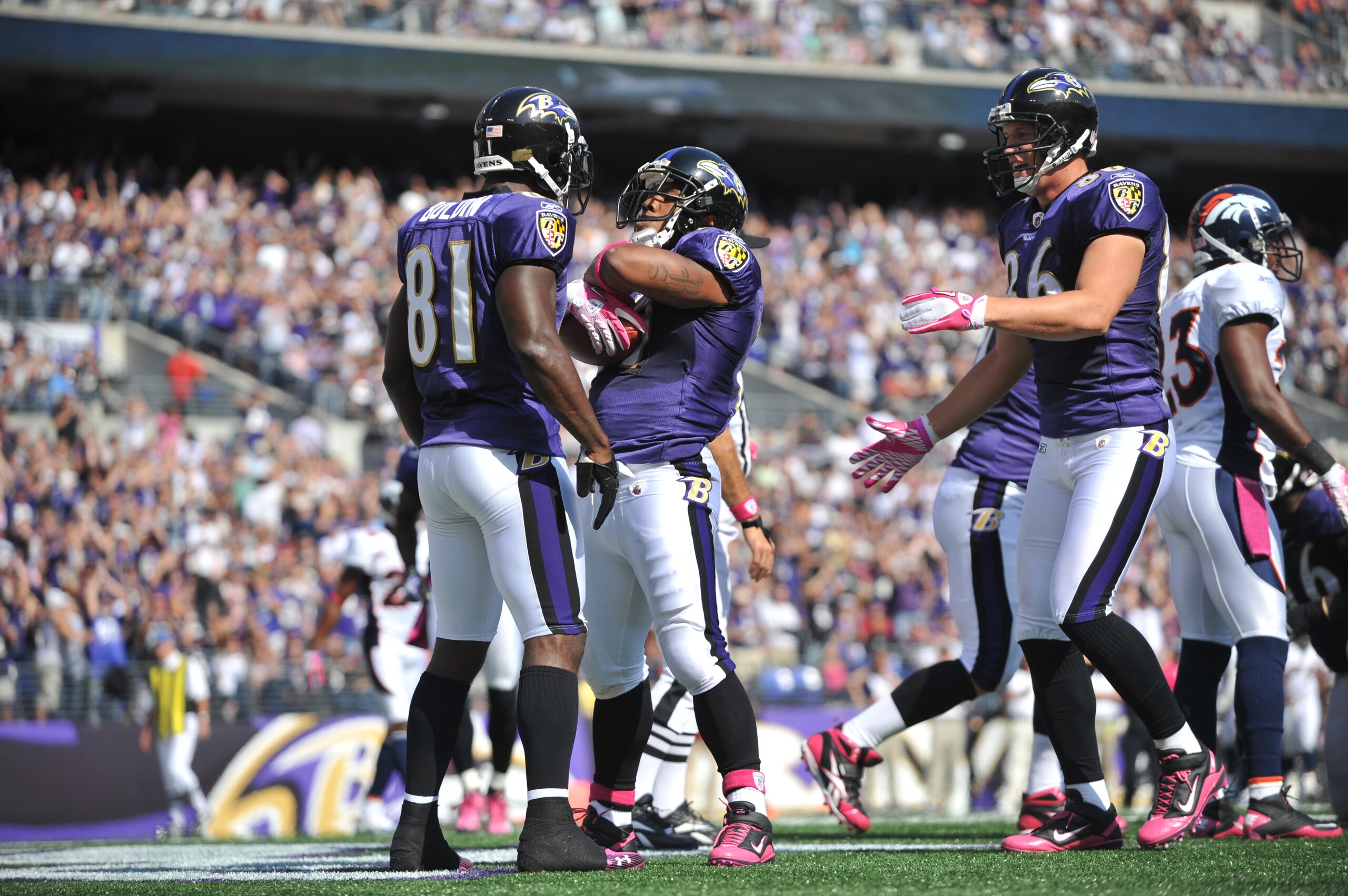 BALTIMORE, MD - OCTOBER 10: Ray Rice #27 of the Baltimore Ravens celebrates a touchdown against the Denver Broncos at M&T Bank Stadium on October 10, 2010 in Baltimore, Maryland. Players wore pink in recognition of Breast Cancer Awareness Month. The Raven
