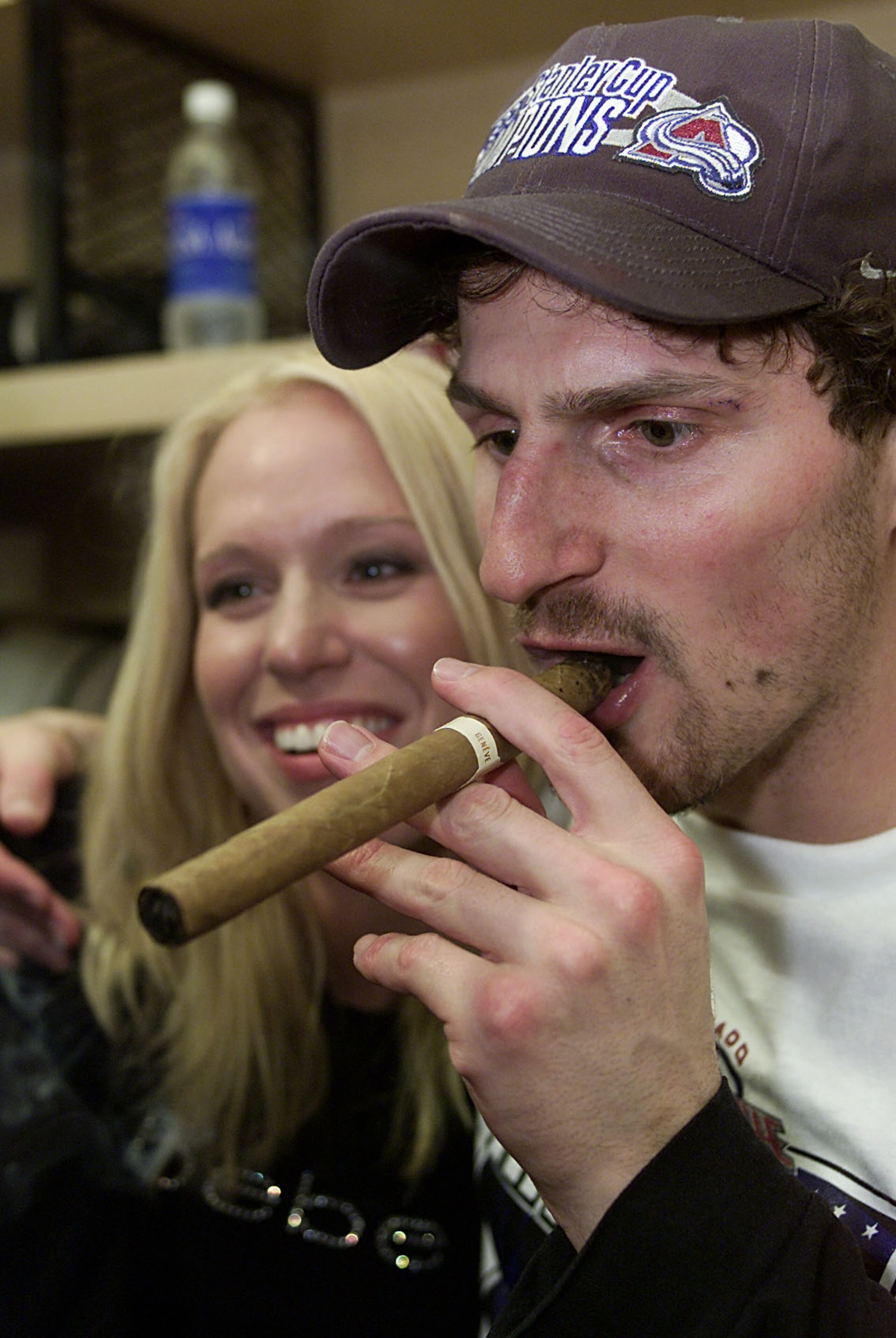 9 Jun 2001:  Milan Hejduk #23 of the Colorado Avalanche lights up a stogie with his wife at his side after Game 7 of the Stanley Cup Finals at the Pepsi Center in Denver, Colorado. The Avalanche won 3-1 to take the Stanley Cup from the New Jersey Devils.