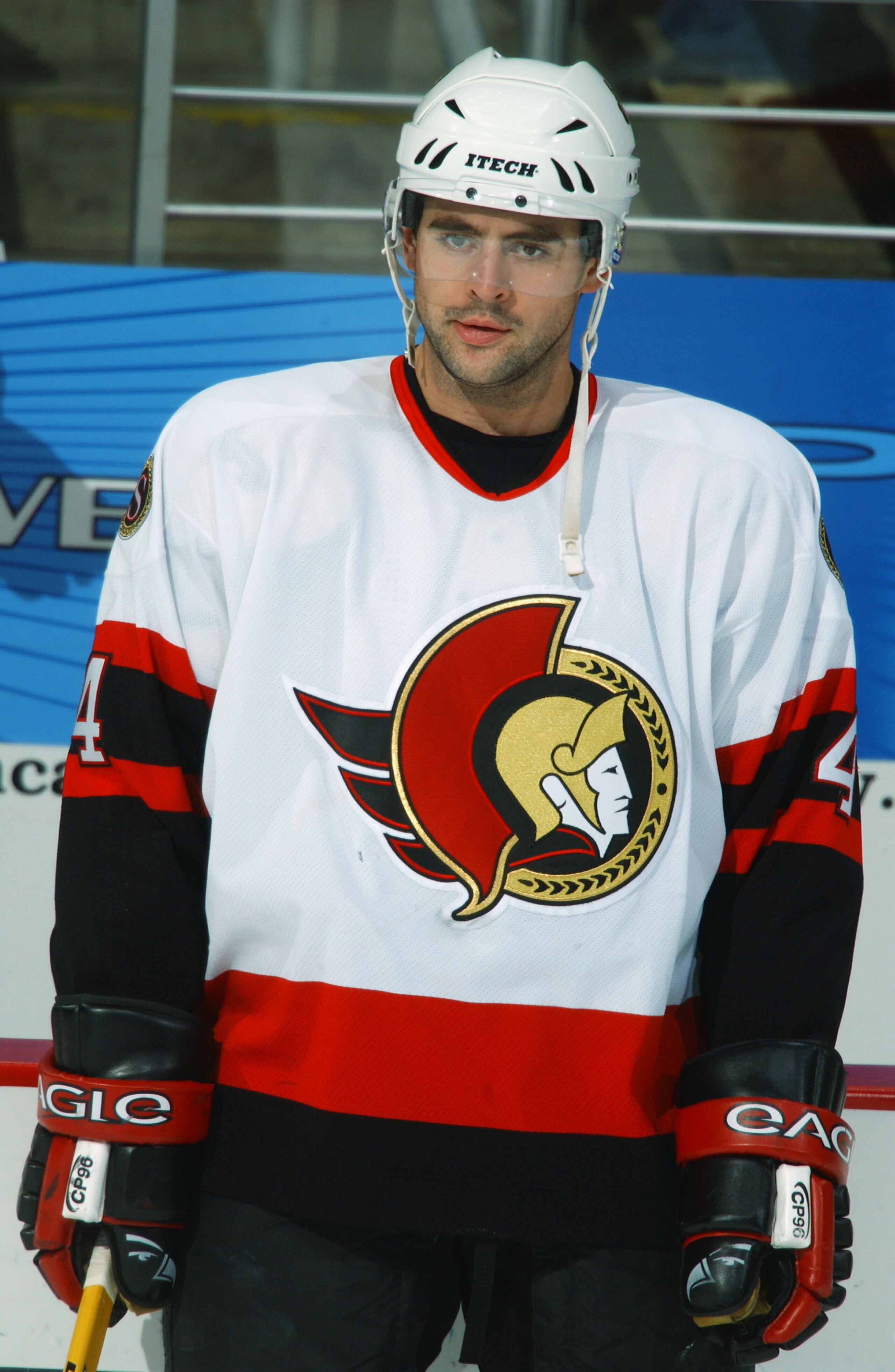 WASHINGTON - NOVEMBER 29:  Chris Phillips #4 of the Ottawa Senators looks on during warmups before the game against the Washington Capitals at the MCI Center on November 29, 2002 in Washington, DC.  The Senators defeated the Capitals 6-2.  (Photo by Mitch