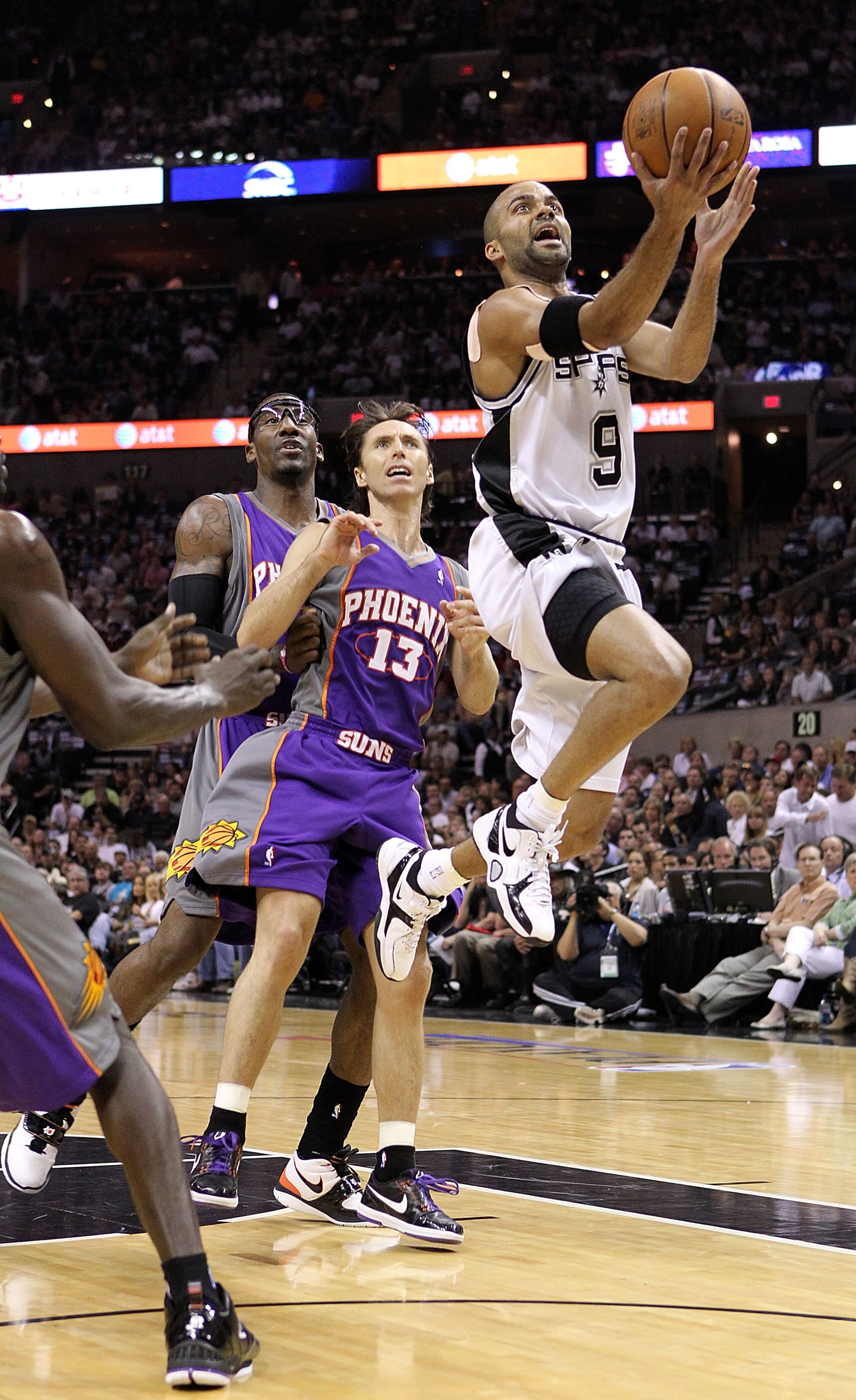 SAN ANTONIO - MAY 09: Guard Tony Parker #9 of the San Antonio Spurs takes a shot against Steve Nash #13 of the Phoenix Suns in Game Four of the Western Conference Semifinals during the 2010 NBA Playoffs at AT&T Center on May 9, 2010 in San Antonio, Texas SAN ANTONIO - MAY 09: Guard Tony Parker #9 of the San Antonio Spurs takes a shot against Steve Nash #13 of the Phoenix Suns in Game Four of the Western Conference Semifinals during the 2010 NBA Playoffs at AT&T Center on May 9, 2010 in San Antonio, Texas