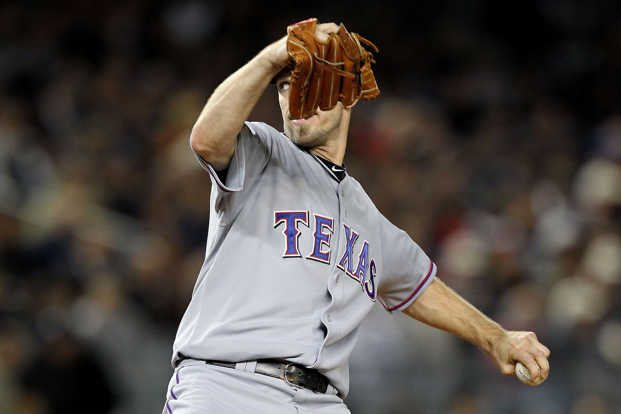 NEW YORK - OCTOBER 18:  Cliff Lee #33 of the Texas Rangers throws a pitch against the New York Yankees in Game Three of the ALCS during the 2010 MLB Playoffs at Yankee Stadium on October 18, 2010 in New York, New York. The Rangers won 8-0.  (Photo by Al B