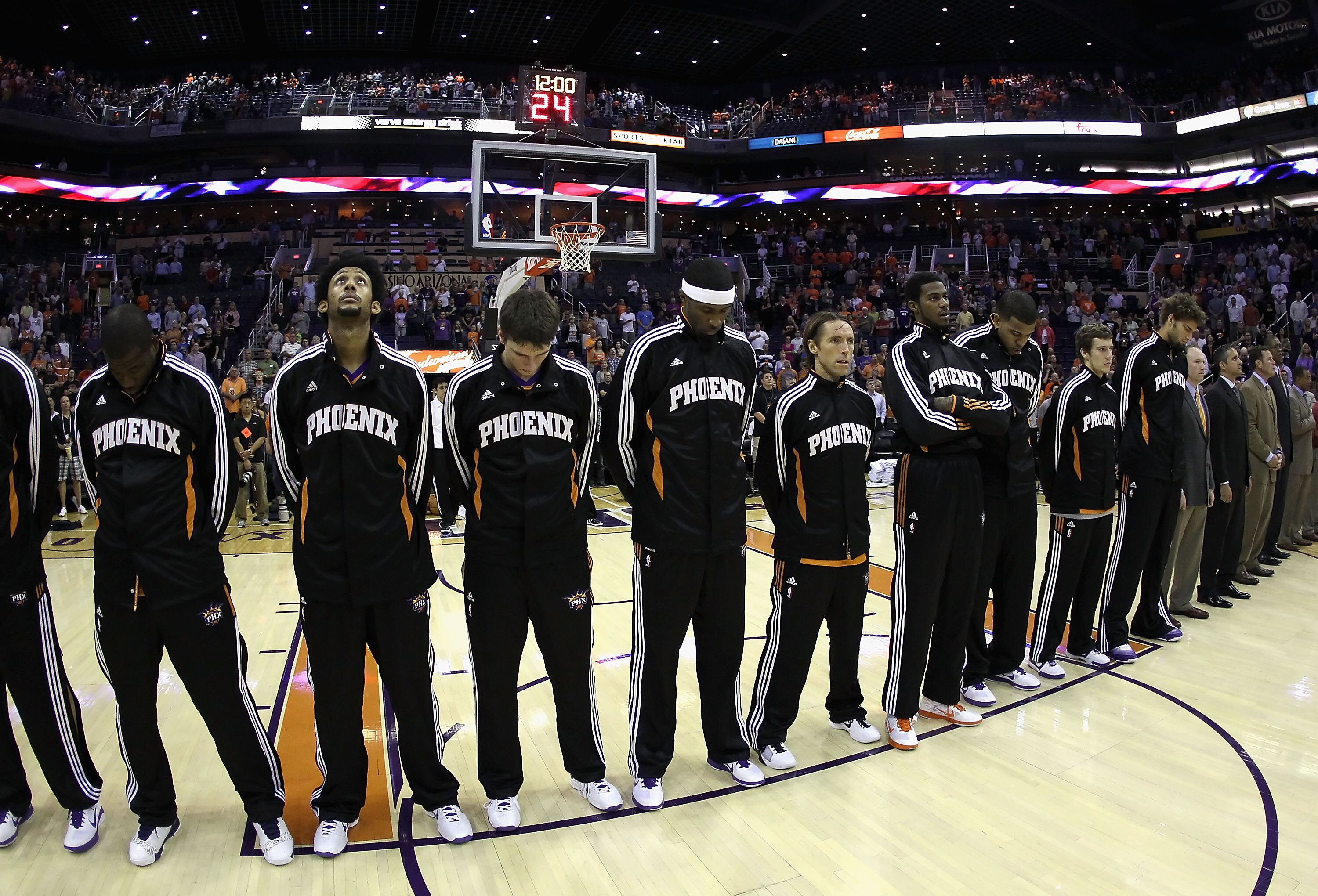 PHOENIX - OCTOBER 19:  The Phoenix Suns line up for the National Anthem during the preseason NBA game against the Golden State Warriors at US Airways Center on October 19, 2010 in Phoenix, Arizona. NOTE TO USER: User expressly acknowledges and agrees that