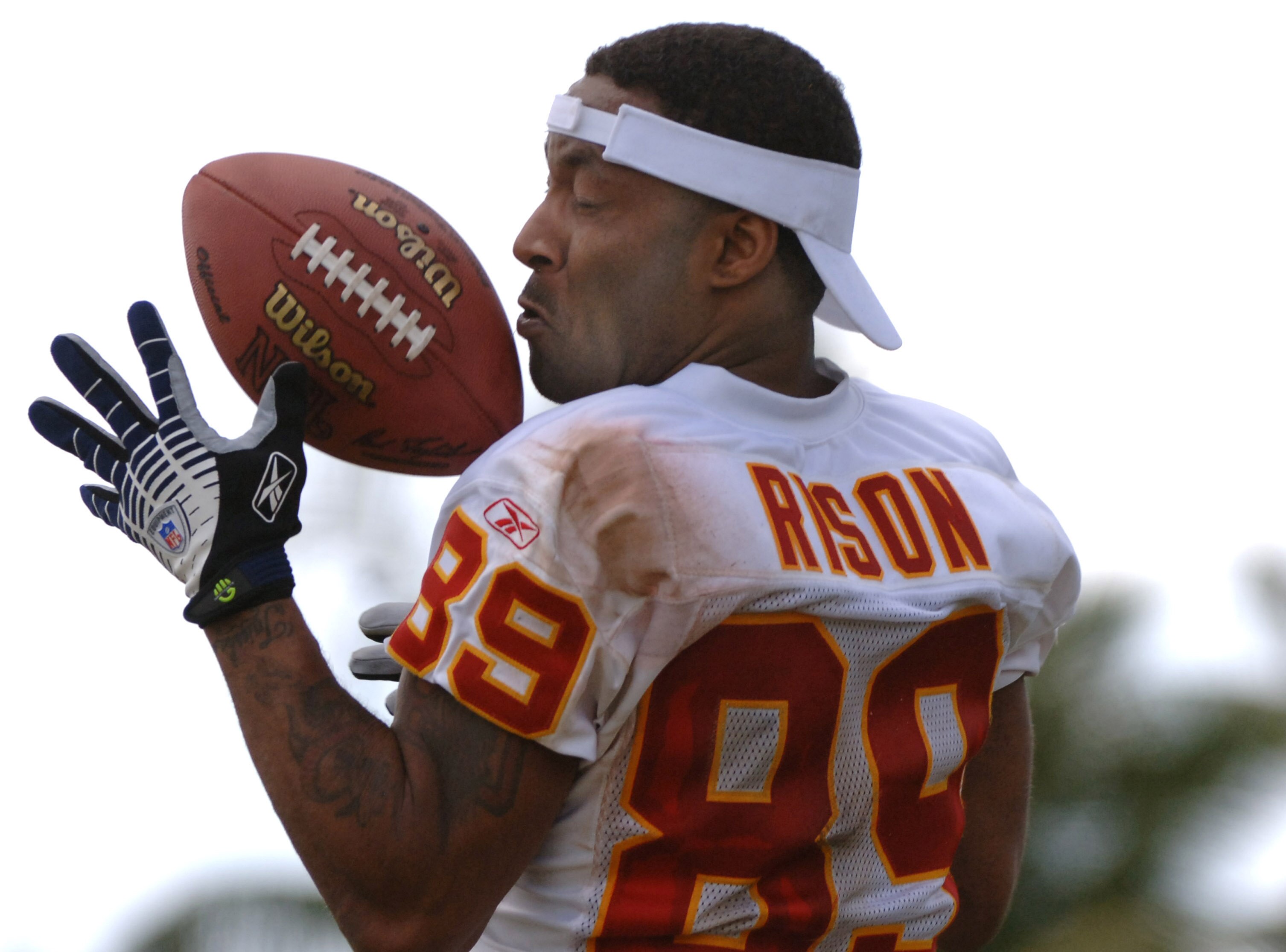 Andre Rison grabs  a pass during an alumni air it out flag football game February 10 before  the 2006 Pro Bowl in Honolulu.  (Photo by Al Messerschmidt/Getty Images)