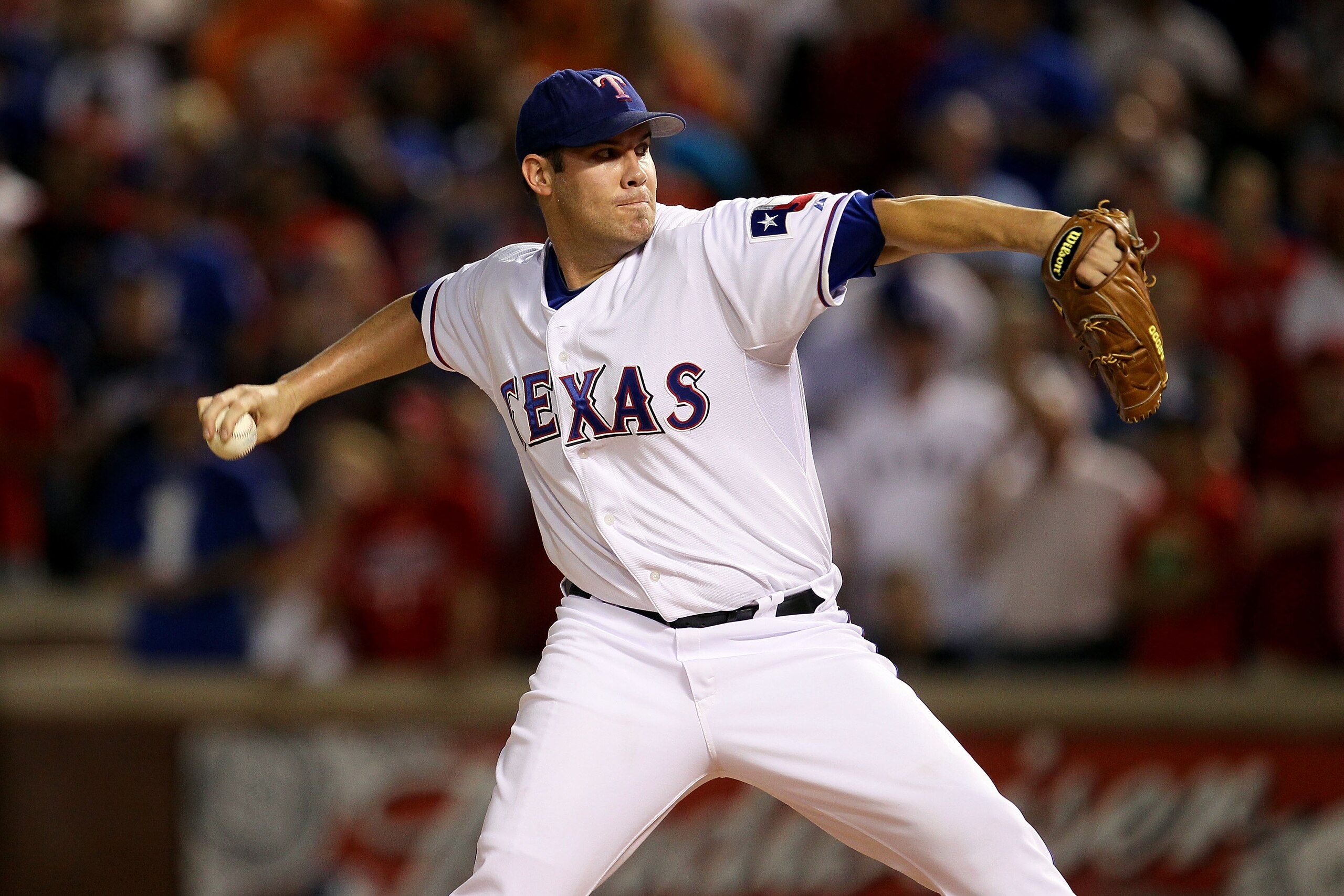 ARLINGTON, TX - OCTOBER 22:  Starting pitcher Colby Lewis #48 of the Texas Rangers pitches against the New York Yankees in the first inning of Game Six of the ALCS during the 2010 MLB Playoffs at Rangers Ballpark in Arlington on October 22, 2010 in Arling