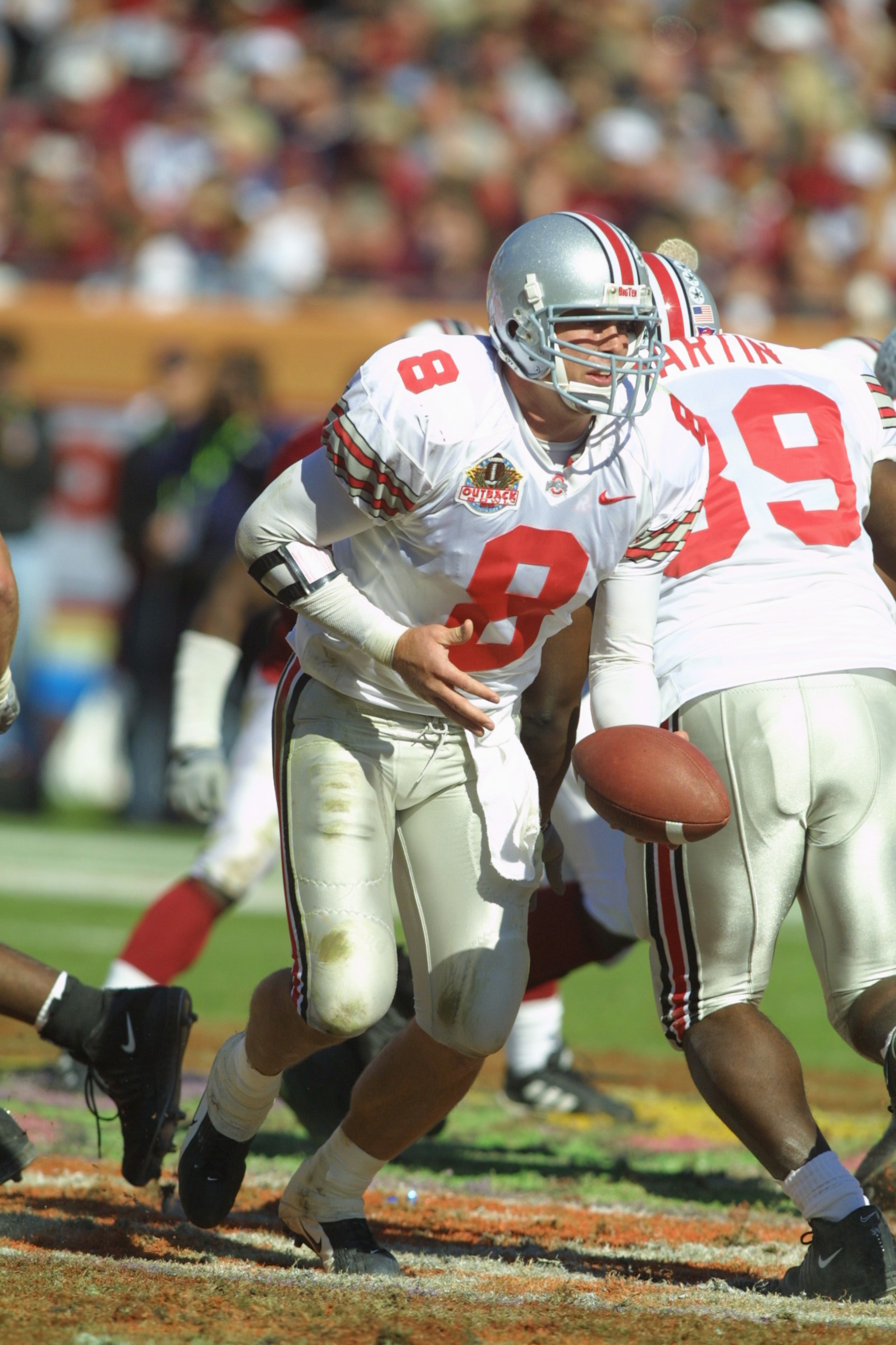 1 Jan 2002:  Ohio State quarterback Steve Bellisari, #8 drops back to handoff against South Carolina in the Outback Bowl at Raymond James Stadium in Tampa, Florida.  USC won 31-28.  DIGITAL IMAGE. Mandatory Credit: Scott Halleran/Getty Images