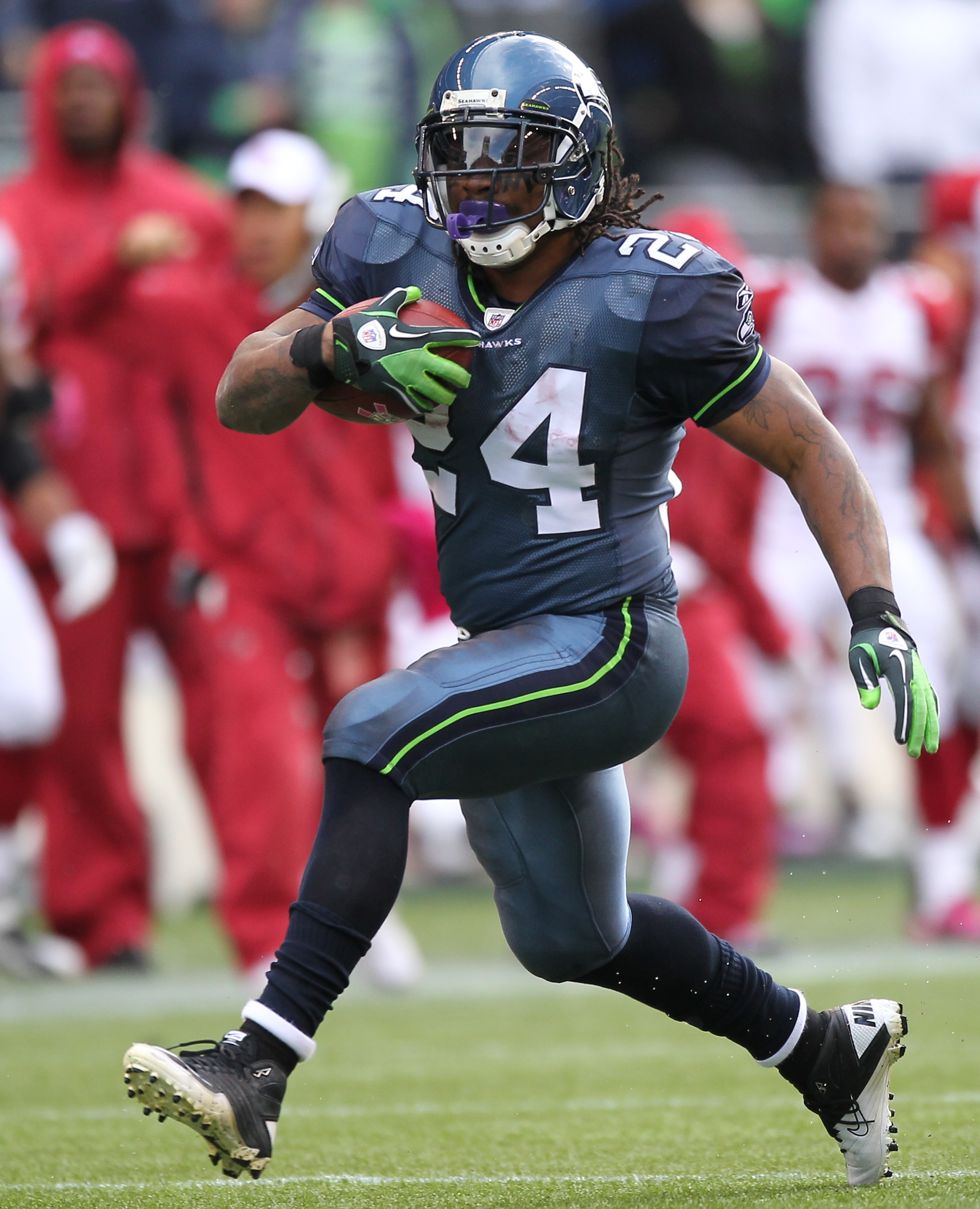 SEATTLE - OCTOBER 24:  Running back Marshawn Lynch #24 of the Seattle Seahawks rushes against the Arizona Cardinals at Qwest Field on October 24, 2010 in Seattle, Washington. (Photo by Otto Greule Jr/Getty Images)