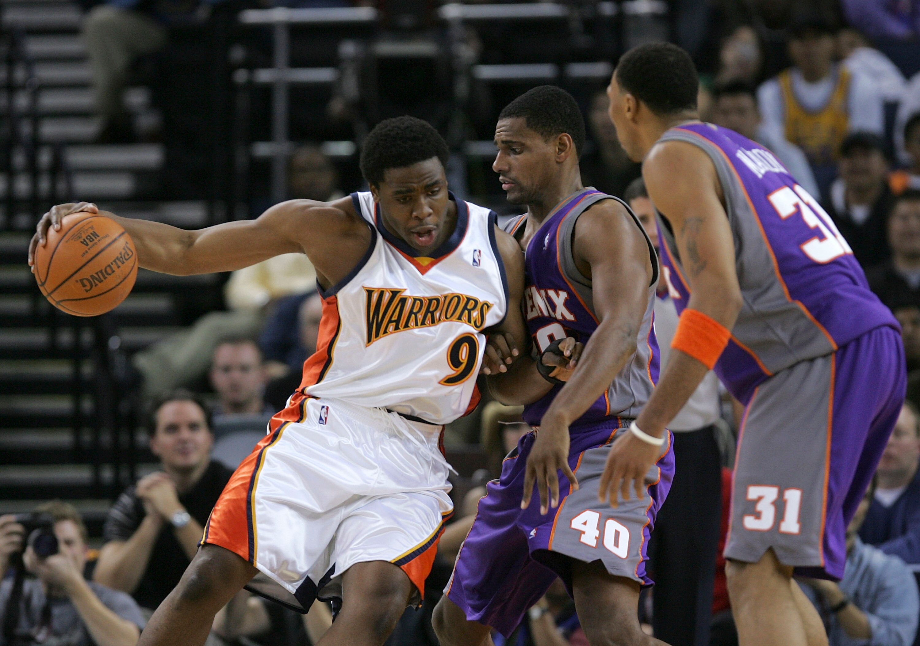 OAKLAND, CA - DECEMBER 07:  Ike Diogu #9 of the Golden State Warriors drives the ball as Kurt Thomas #40 and Shawn Marion #31 of the Phoenix Suns defend on December 7, 2005 at the Arena in Oakland, California. NOTE TO USER: User expressly acknowledges and