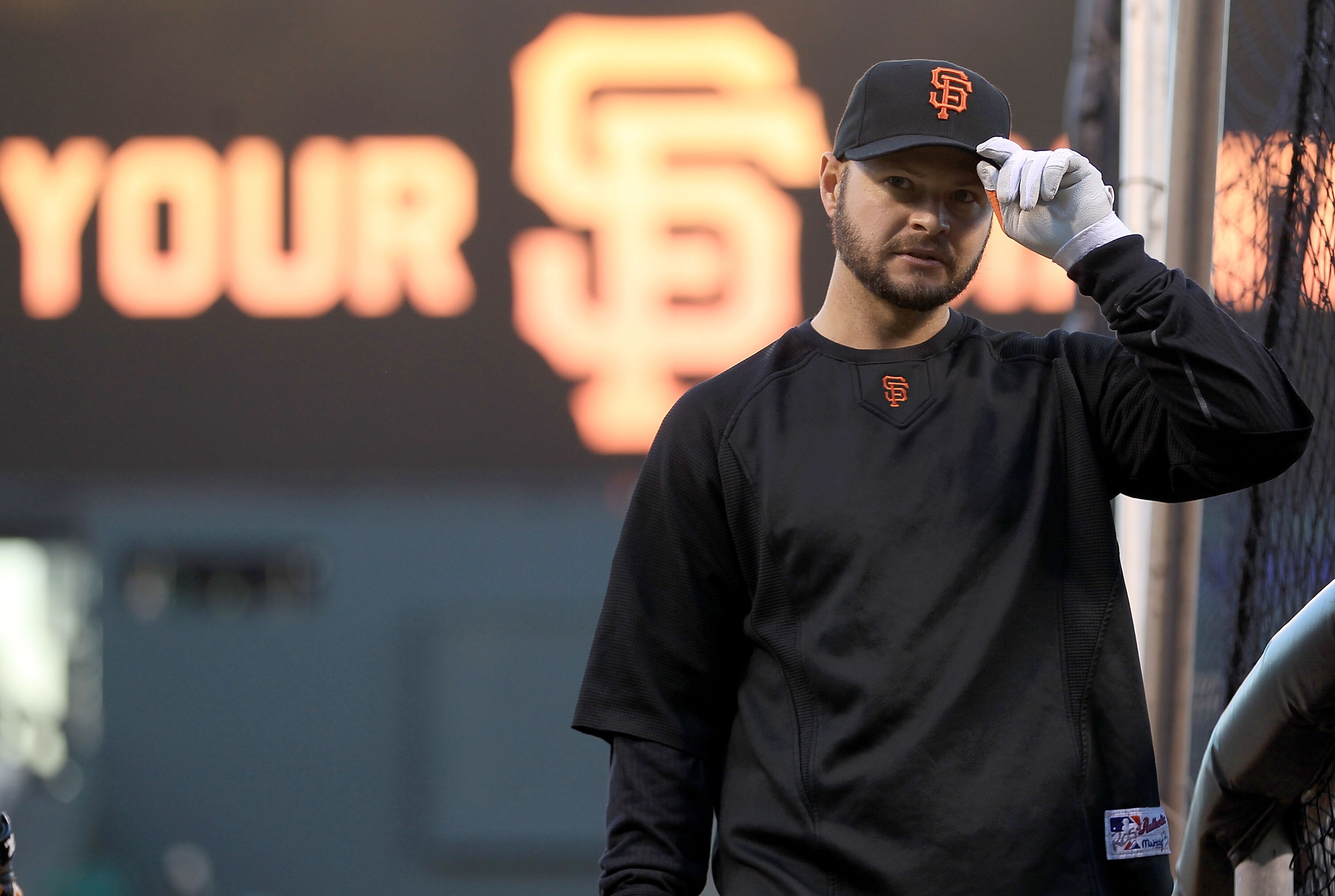 SAN FRANCISCO - OCTOBER 26:  Cody Ross #13 of the San Francisco Giants stands on the field during a workout session at AT&T Park on October 26, 2010 in San Francisco, California. The Texas Rangers will face off against the San Francisco Giants in Game One