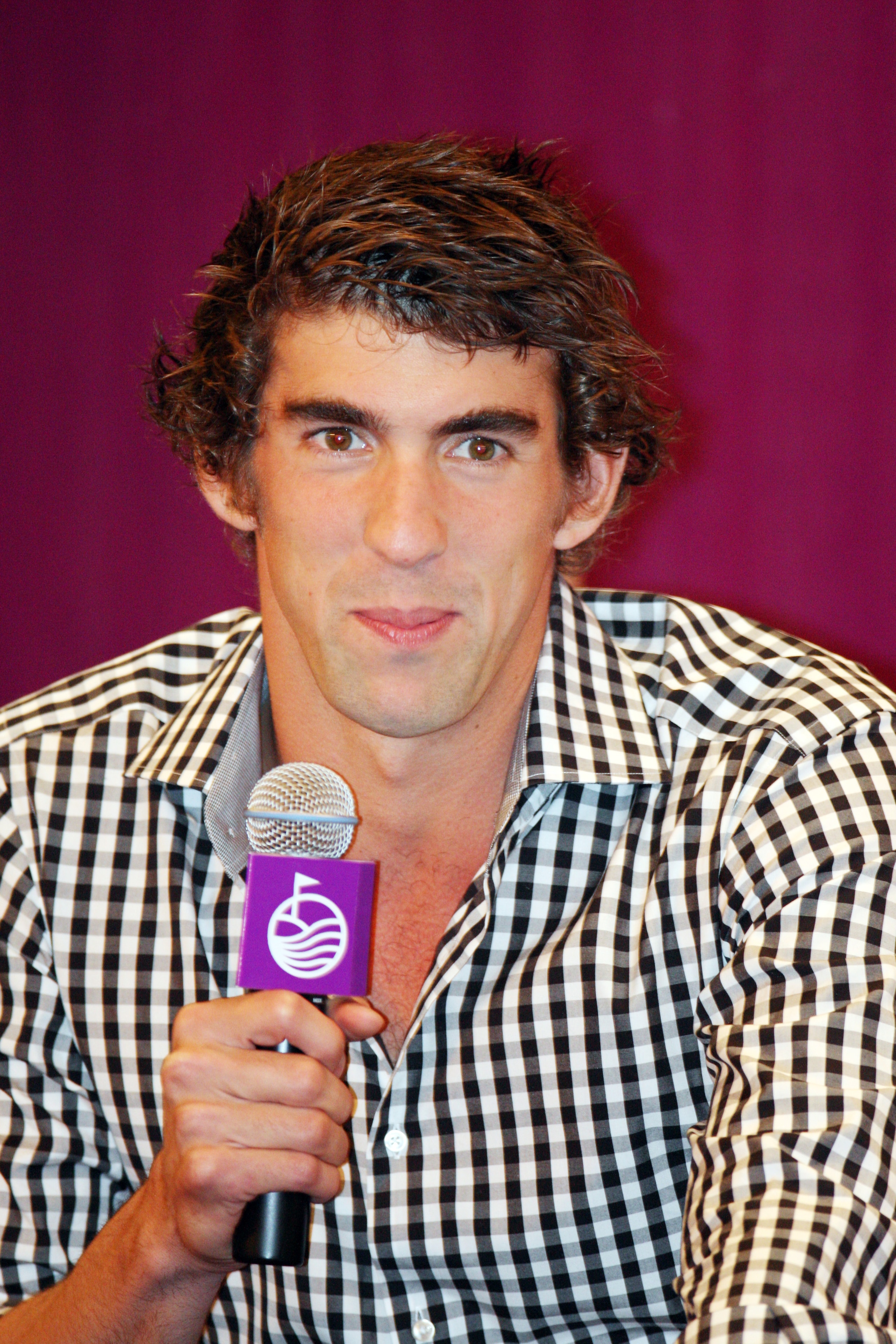 HAIKOU, CHINA - OCTOBER 27:  Multiple Olympic gold medalist Michael Phelps of USA answers a question from media during the openingpress conference of the Mission Hills Star Trophy on October 27, 2010 in Haikou, China. The Mission Hills Star Trophy is Asia