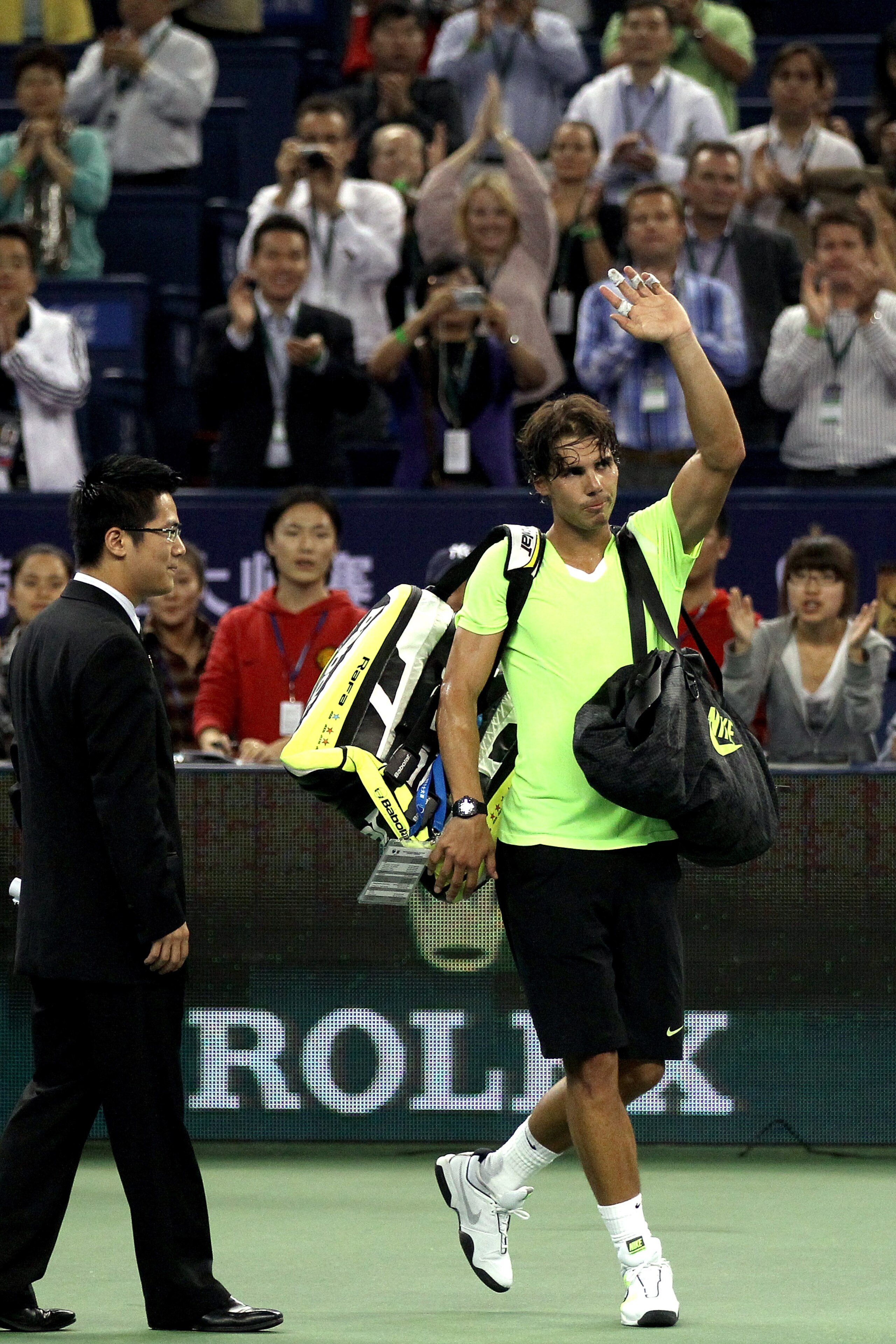 SHANGHAI, CHINA - OCTOBER 14:  Rafael Nadal of Spain leaves the court after loosing to Jurgen Melzer of Austria during day four of the 2010 Shanghai Rolex Masters at the Shanghai Qi Zhong Tennis Center on October 13, 2010 in Shanghai, China.  (Photo by Ma