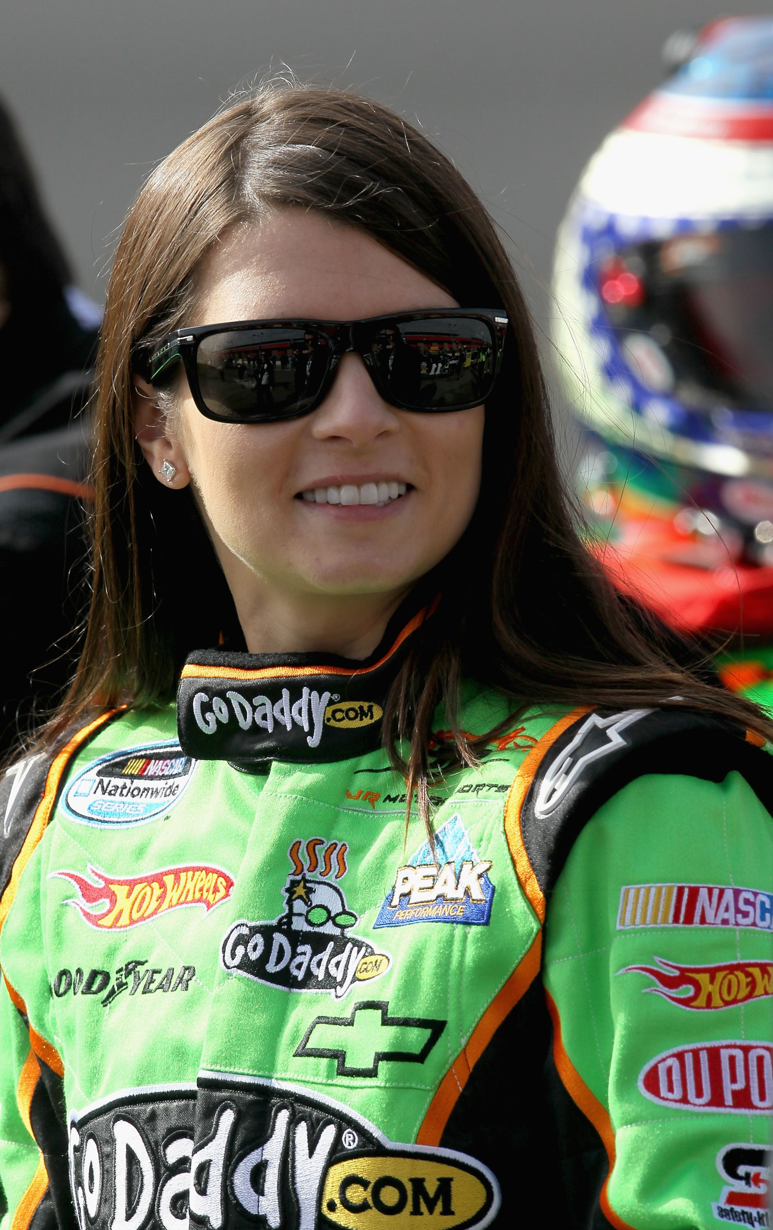 FONTANA, CA - FEBRUARY 20:  Danica Patrick, driver of the #7 of the GoDaddy.com Chevrolet, smiles while on pit road during qualifying for the NASCAR Nationwide Series Stater Bros. 300 at Auto Club Speedway on February 20, 2010 in Fontana, California.  (Ph