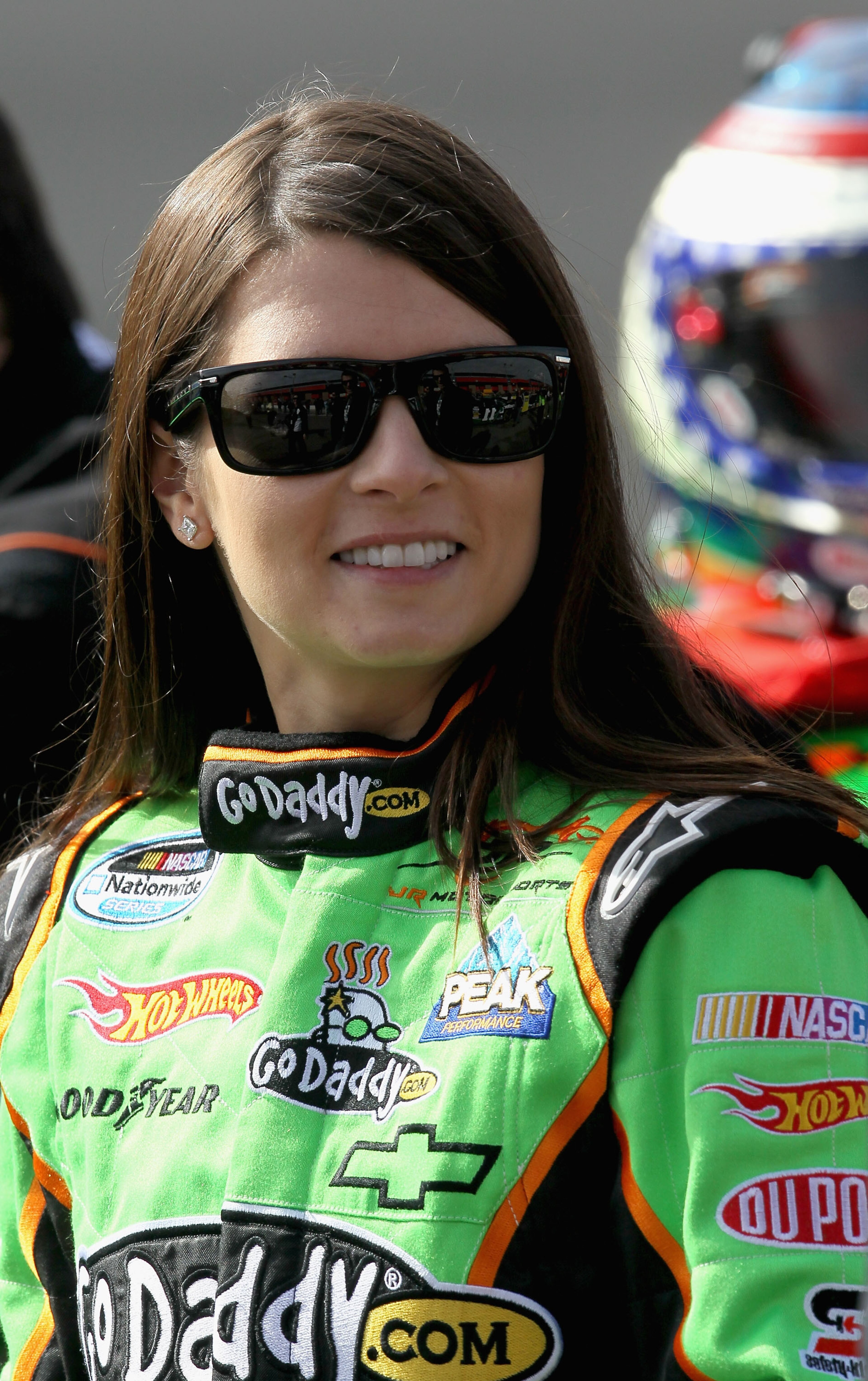 FONTANA, CA - FEBRUARY 20:  Danica Patrick, driver of the #7 of the GoDaddy.com Chevrolet, smiles while on pit road during qualifying for the NASCAR Nationwide Series Stater Bros. 300 at Auto Club Speedway on February 20, 2010 in Fontana, California.  (Ph