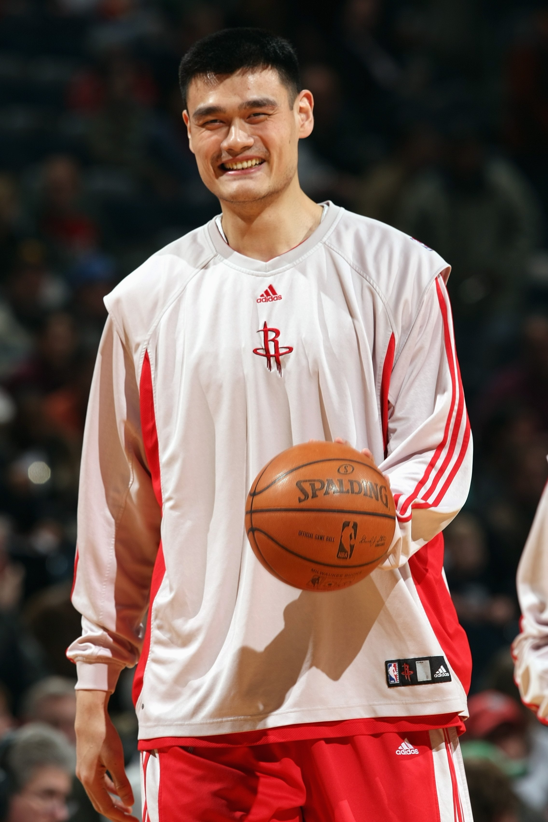 MILWAUKEE - FEBRUARY 02:  Yao Ming #11 of the Houston Rockets looks on with a smile during warm-ups prior to the game against the Milwaukee Bucks at the Bradley Center on February 2, 2008 in Milwaukee, Wisconsin. The Rockets defeated the Bucks 91-83.  NOT