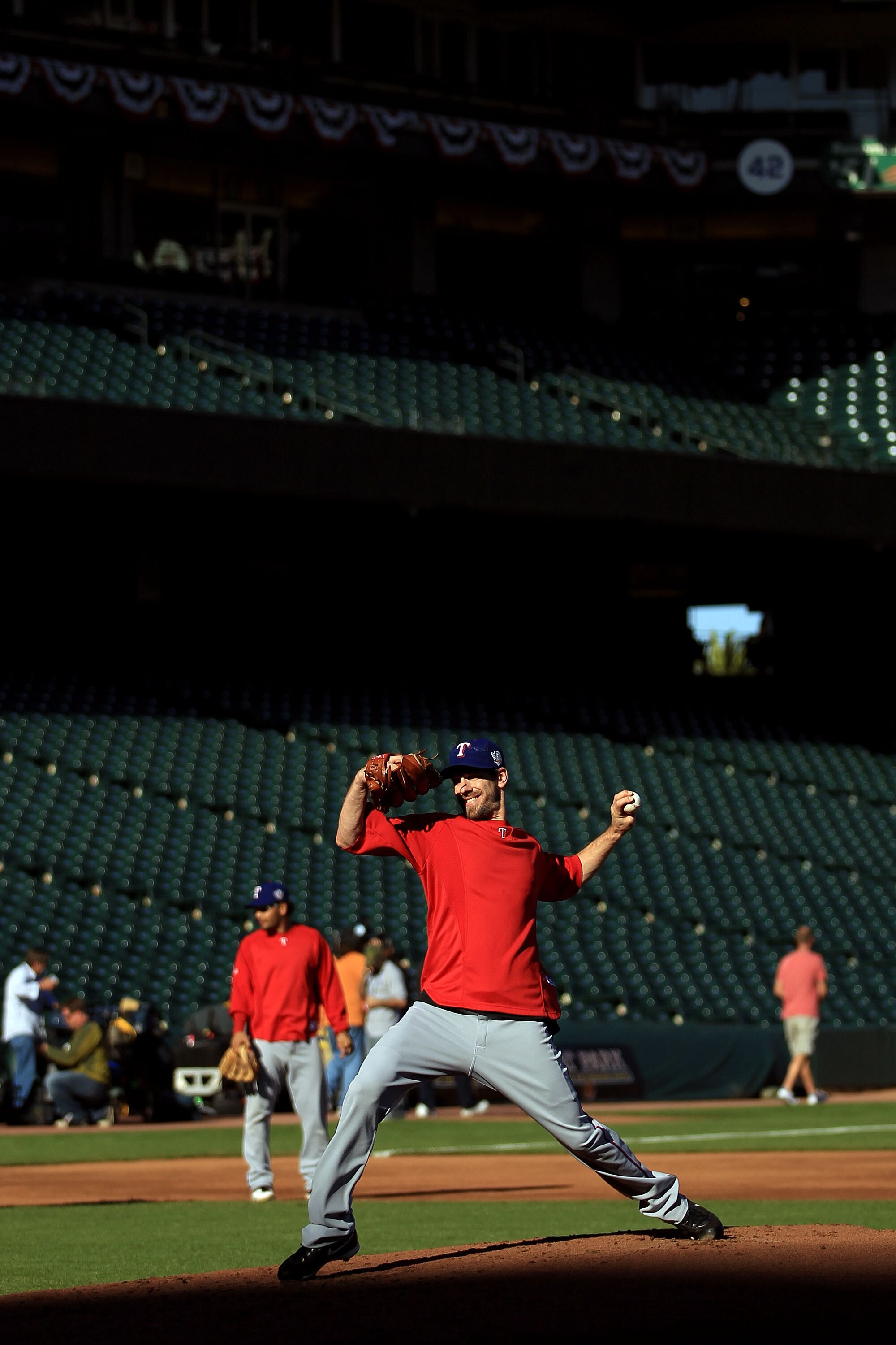 SAN FRANCISCO - OCTOBER 26:  Cliff Lee #33 of the Texas Rangers pitches during a workout session at AT&T Park on October 26, 2010 in San Francisco, California. The Texas Rangers will face off against the San Francisco Giants in Game One of the 2010 MLB Wo