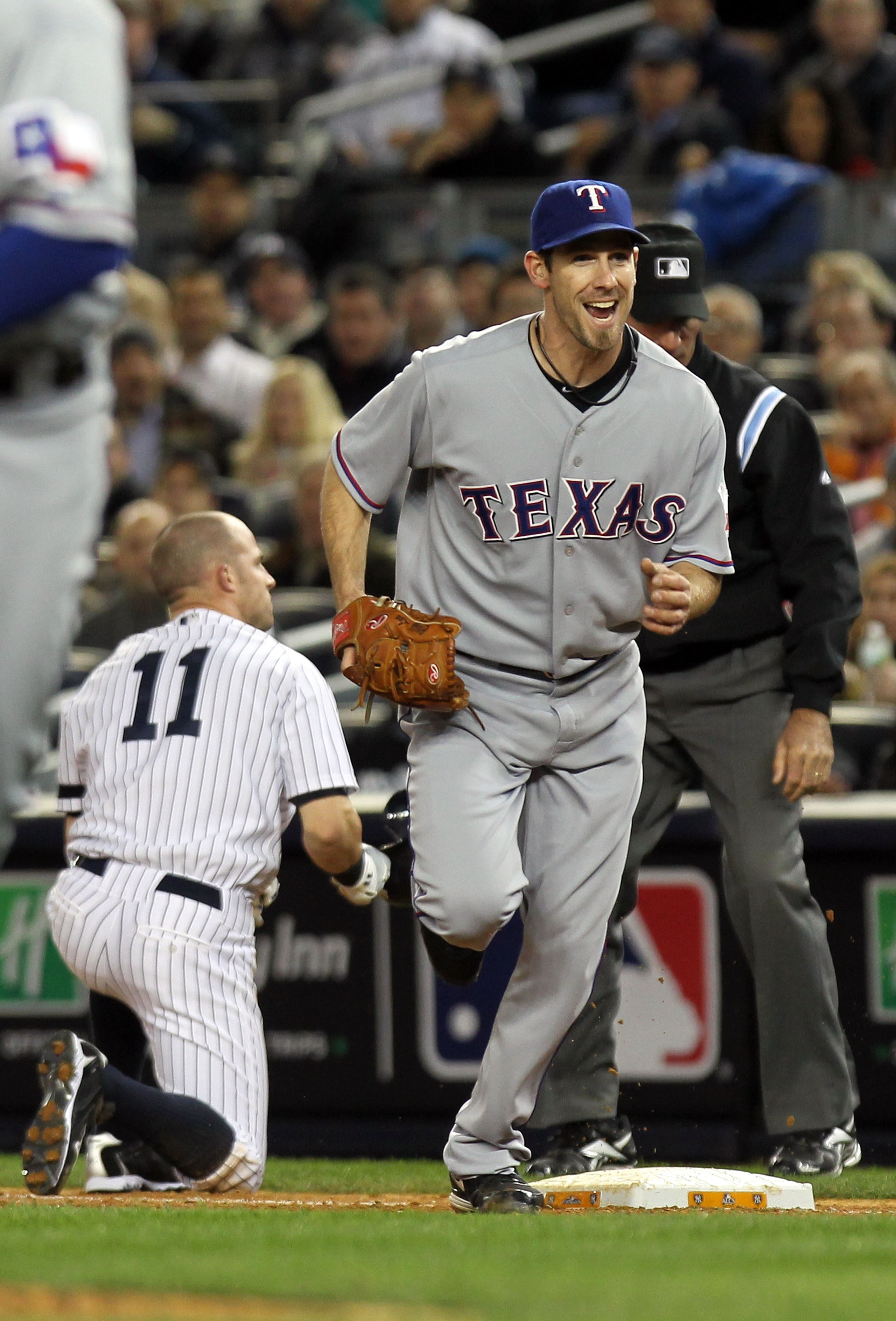 NEW YORK - OCTOBER 18:  Cliff Lee #33 of the Texas Rangers reacts after he forced out Brett Gardner #11 of the New York Yankees at first base in the bottom of the third inning of Game Three of the ALCS during the 2010 MLB Playoffs at Yankee Stadium on Oct