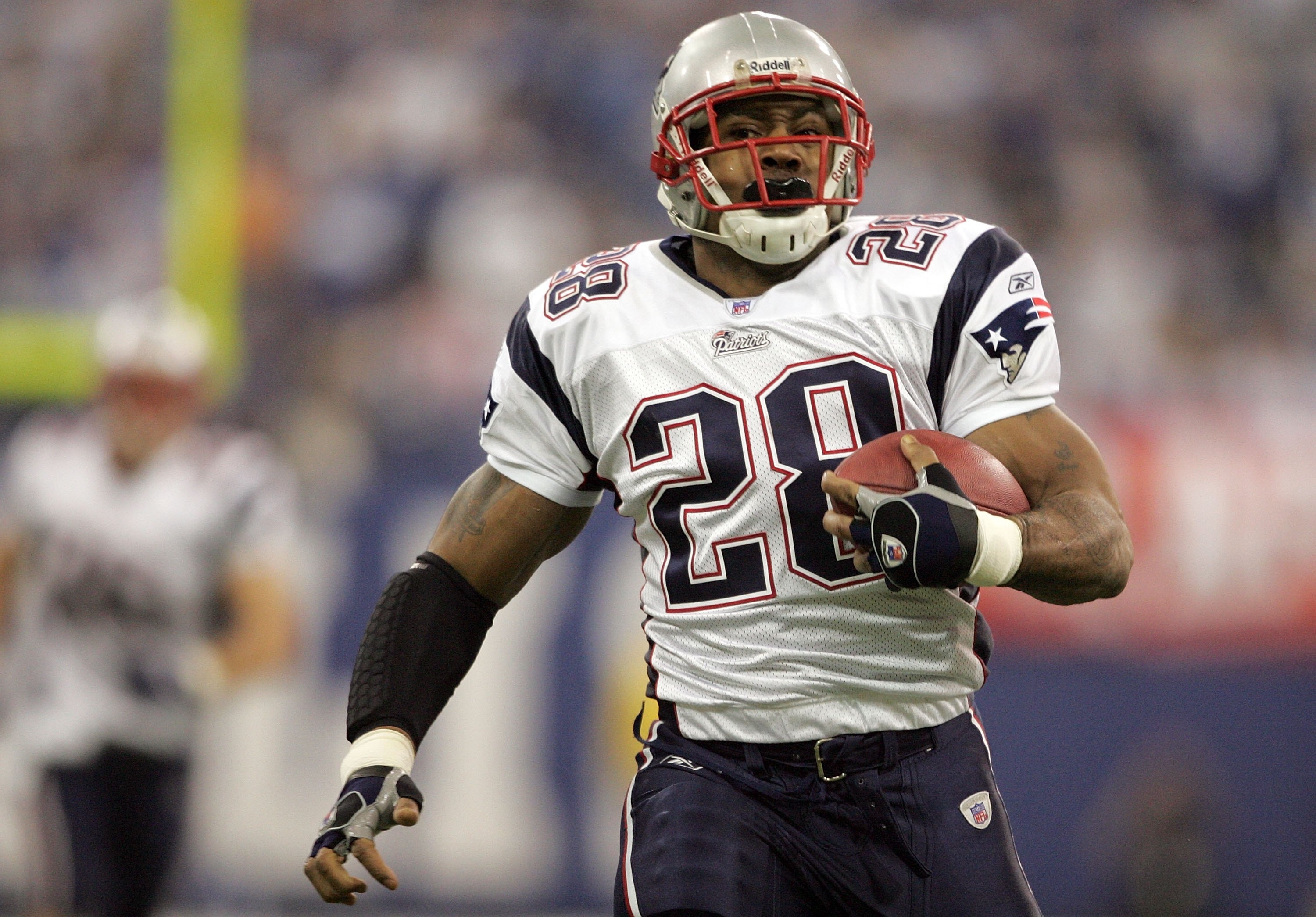 INDIANAPOLIS - JANUARY 21:  Corey Dillon #28 of the New England Patriots runs for 35 yards against the Indianapolis Colts during the AFC Championship Game on January 21, 2007 at the RCA Dome in Indianapolis, Indiana.  (Photo by Andy Lyons/Getty Images)