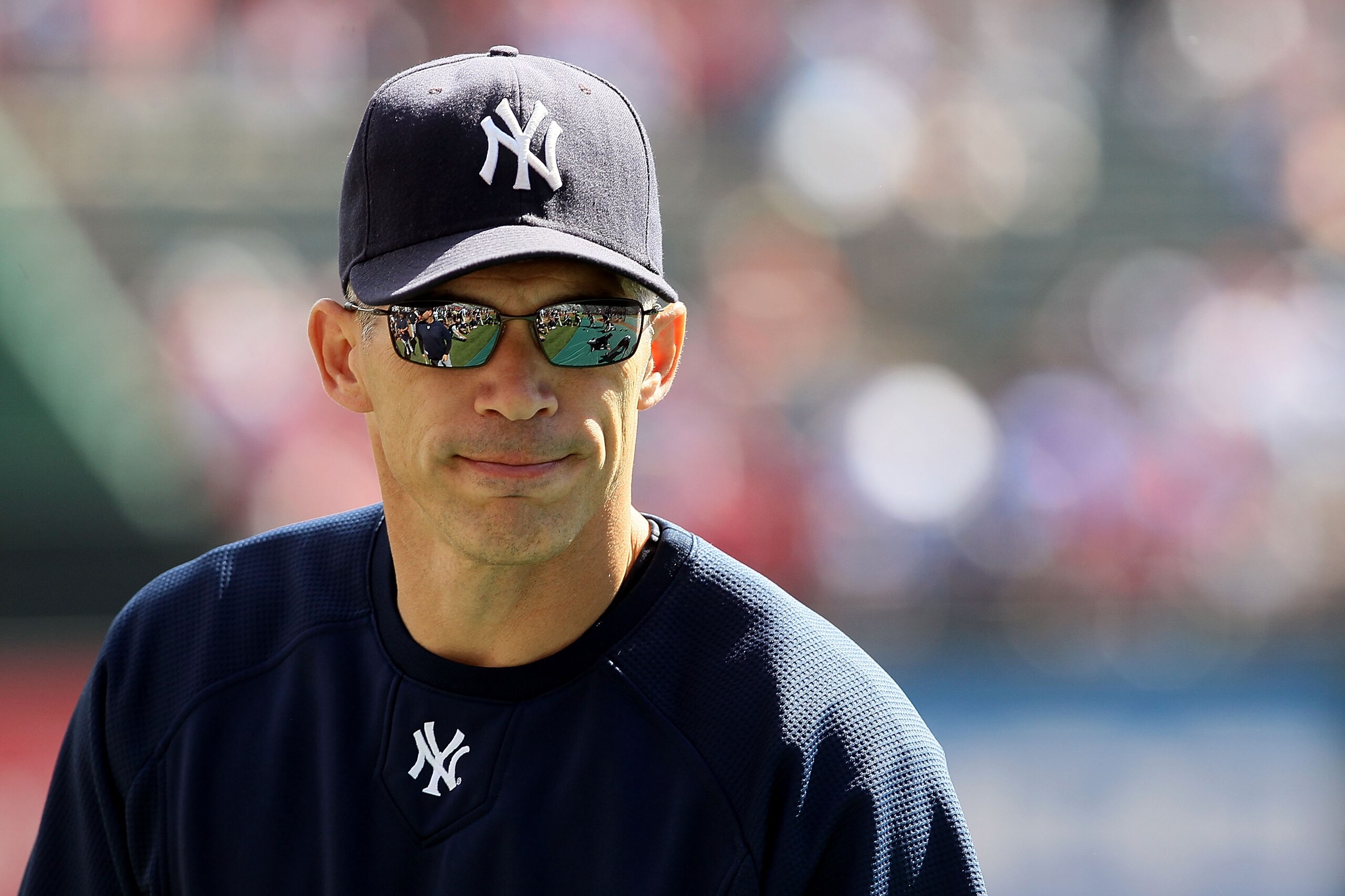 ARLINGTON, TX - OCTOBER 16:  Manager Joe Girardi #28 of the New York Yankees looks on during batting practice against the Texas Rangers in Game Two of the ALCS during the 2010 MLB Playoffs at Rangers Ballpark in Arlington on October 16, 2010 in Arlington,