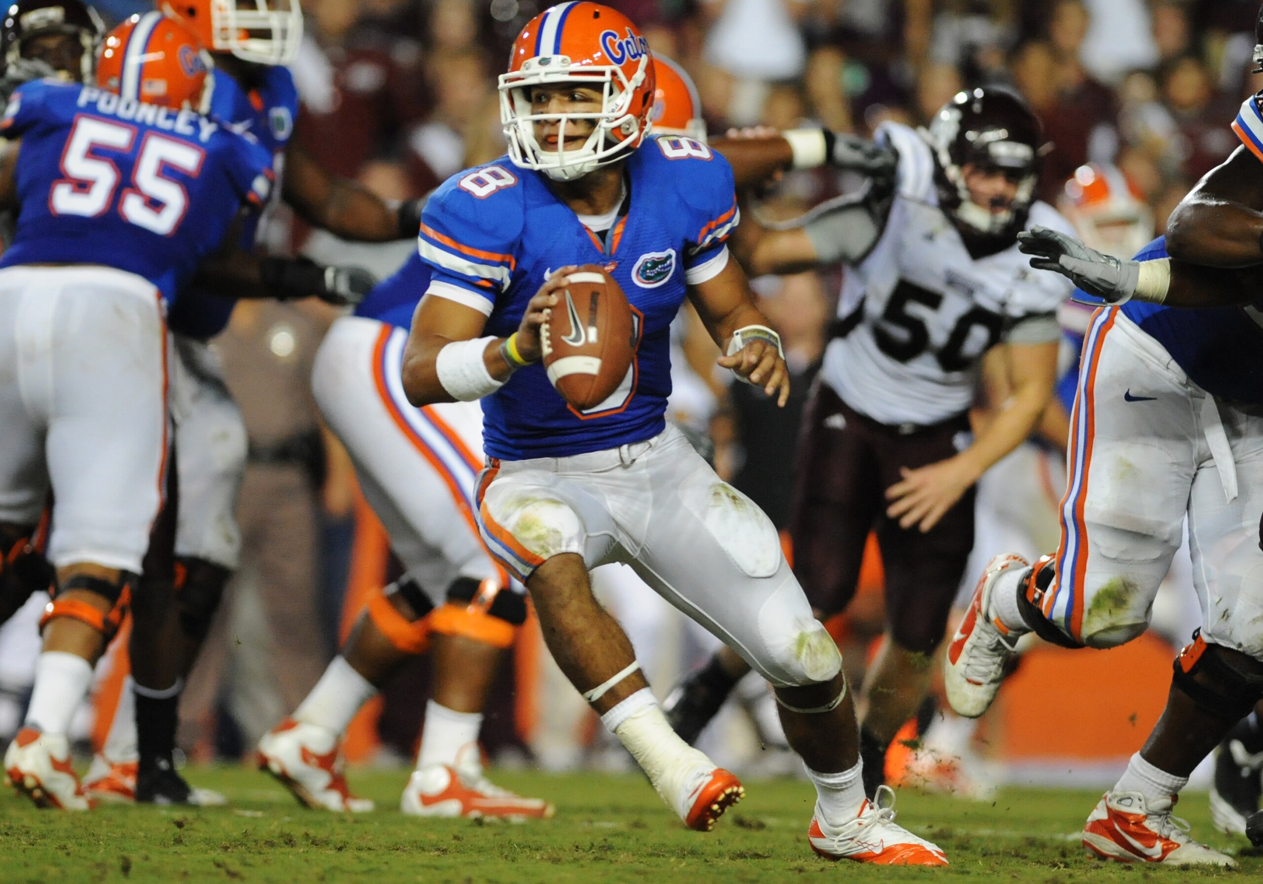GAINESVILLE, FL - OCTOBER 16:  Quarterback Trey Burton #8 of the Florida Gators looks to lateral against the Mississippi State Bulldogs  October 16, 2010 Ben Hill Griffin Stadium at Gainesville, Florida.  (Photo by Al Messerschmidt/Getty Images)