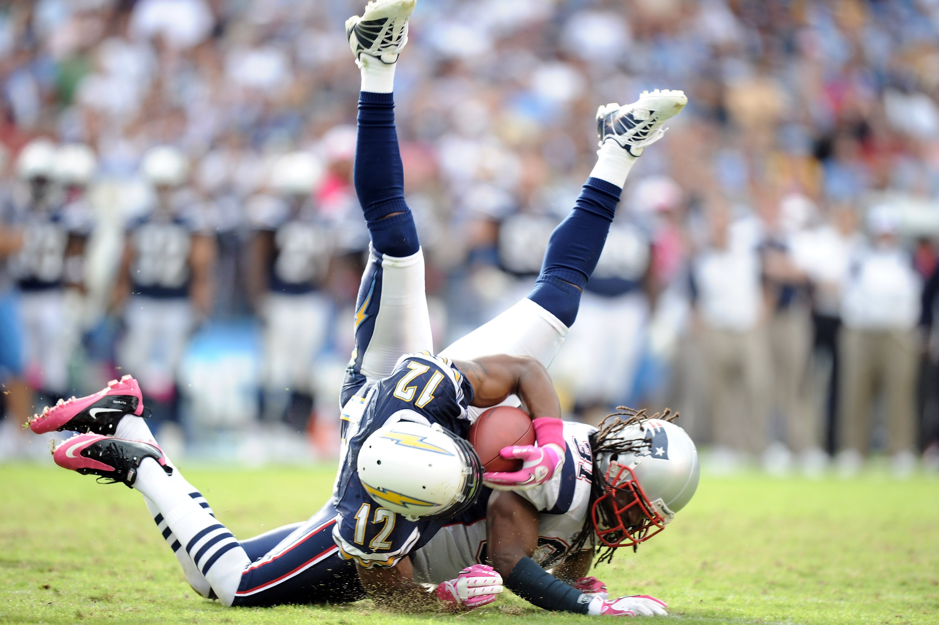 SAN DIEGO - OCTOBER 24:  Brandon Meriweather #31 of the New England Patriots up ends Patrick Crayton #12 of the San Diego Chargers during the fourth quarter at Qualcomm Stadium on October 24, 2010 in San Diego, California.  (Photo by Harry How/Getty Image