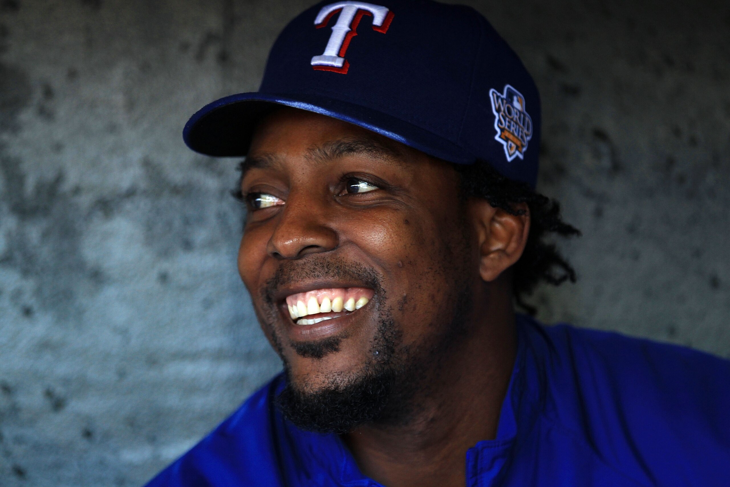 SAN FRANCISCO - OCTOBER 26:  Vladimir Guerrero #27 of the Texas Rangers smiles while sittting in the dugout during a workout session at AT&T Park on October 26, 2010 in San Francisco, California. The Texas Rangers will face off against the San Francisco G