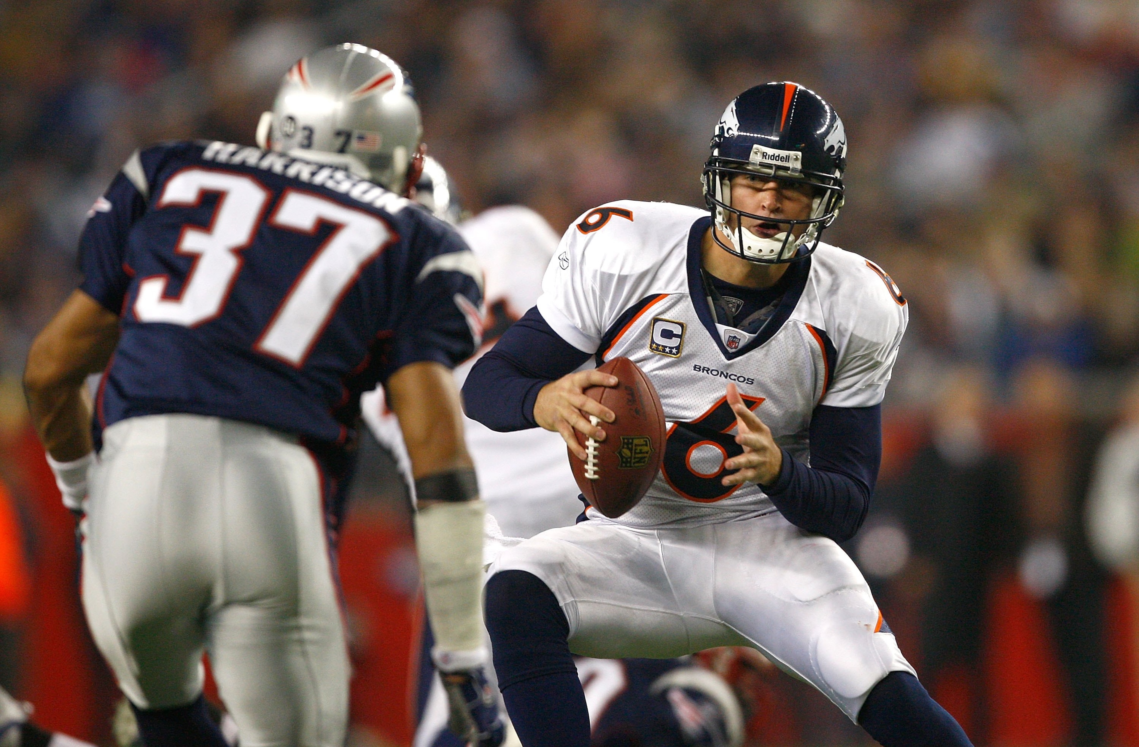 FOXBORO, MA - OCTOBER 20: Jay Cutler #6 of the Denver Broncos is confronted by Rodney Harrison #37 of the New ngland Patriots at Gillette Stadium on October 20, 2008 in Foxboro, Massachusetts. The Paytiots won 41-7. (Photo by Jim Rogash/Getty Images)
