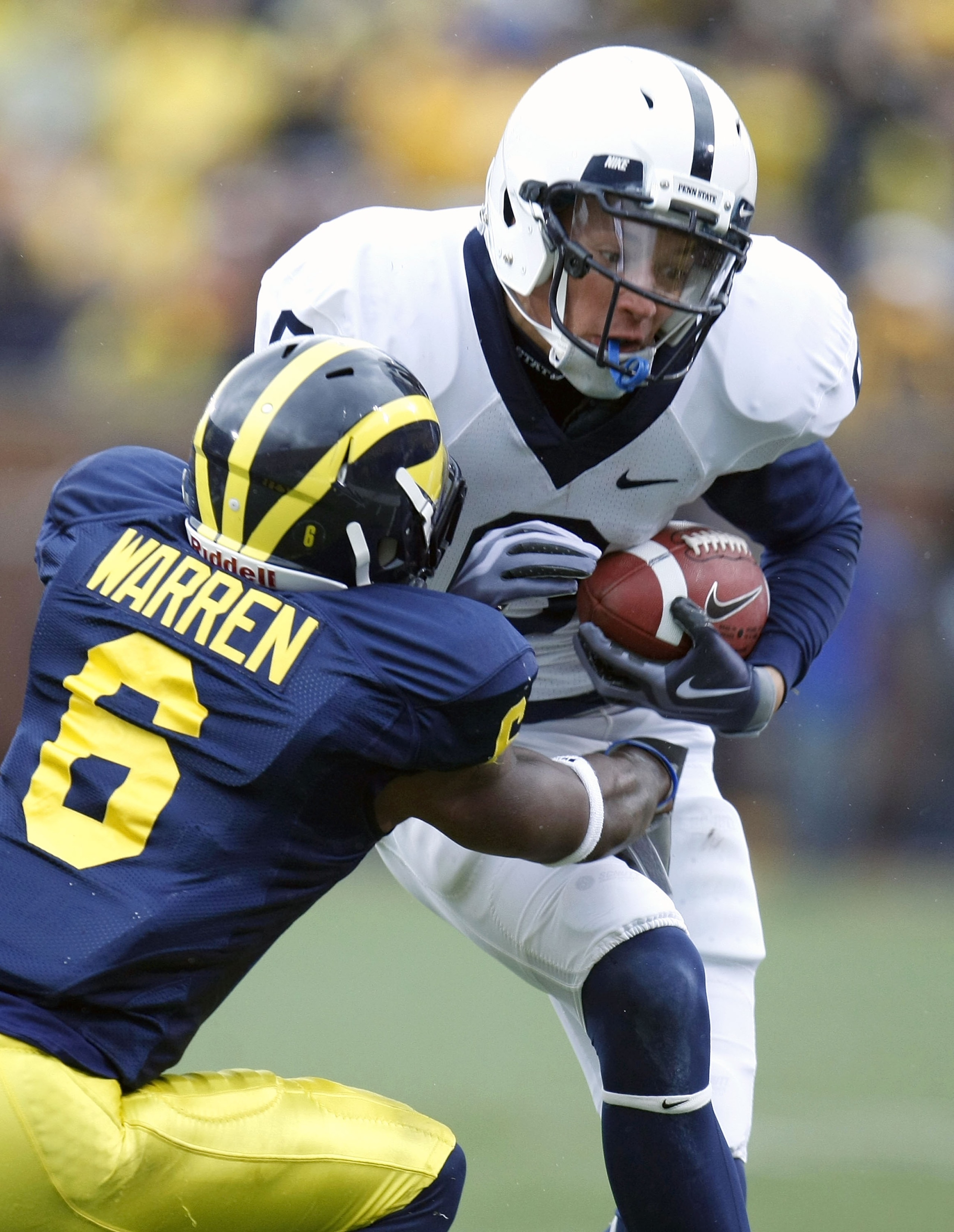 ANN ARBOR, MI - OCTOBER 24:  Derek Moye #6 of the Penn State Nittany Lions is takled by Donovan Warren #6 of the Michigan Wolverines on October 24, 2009 at Michigan Stadium in Ann Arbor, Michigan. Penn State won the game 35-10. (Photo by Gregory Shamus/Ge