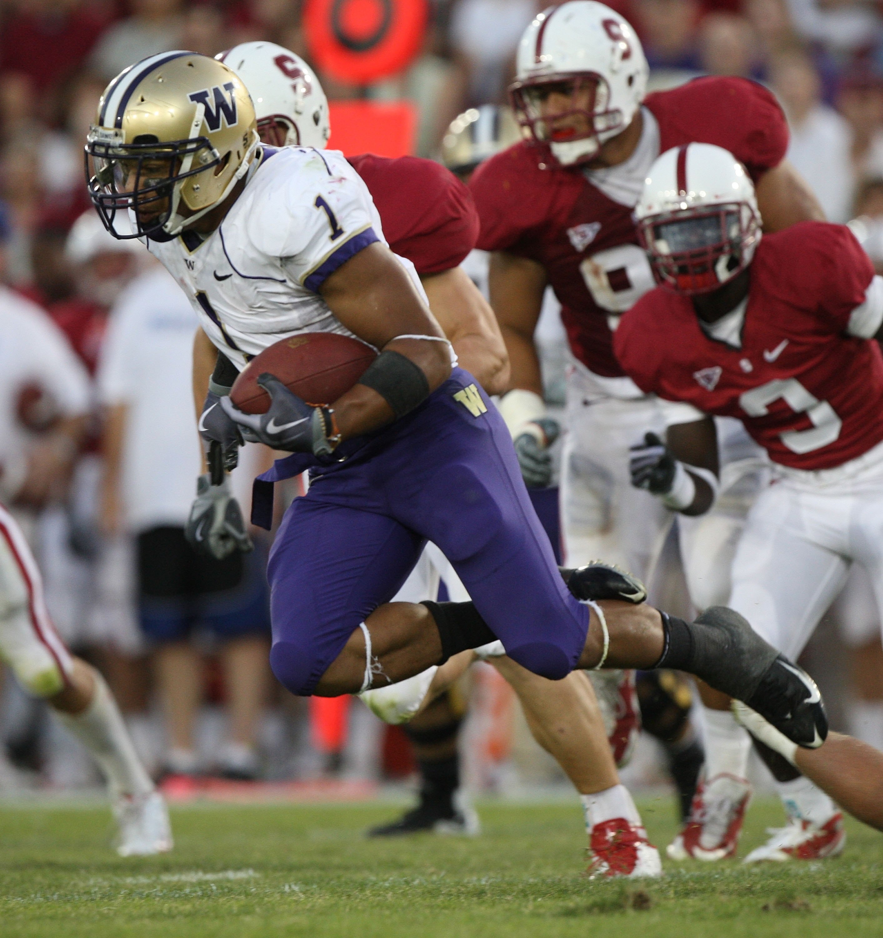 PALO ALTO, CA - SEPTEMBER 26:  Chris Polk #1 of the Washington Huskies runs against the Stanford Cardinal at Stanford Stadium on September 26, 2009 in Palo Alto, California.  (Photo by Jed Jacobsohn/Getty Images)