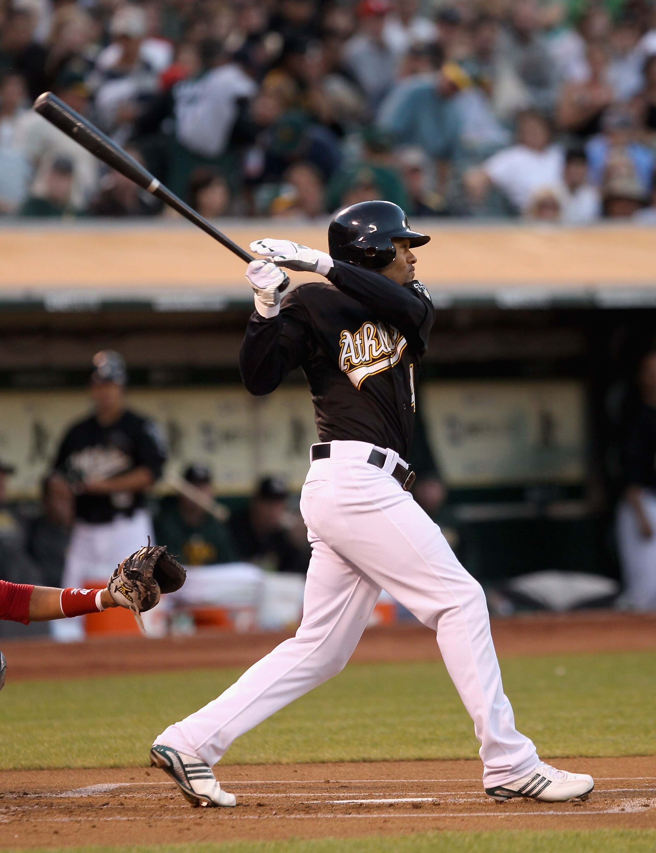 OAKLAND, CA - SEPTEMBER 10: Coco Crisp #4 of the Oakland Athletics hits a single in the first inning of their game against the Boston Red Sox at the Oakland-Alameda County Coliseum on September 10, 2010 in Oakland, California. He later scored in the innin