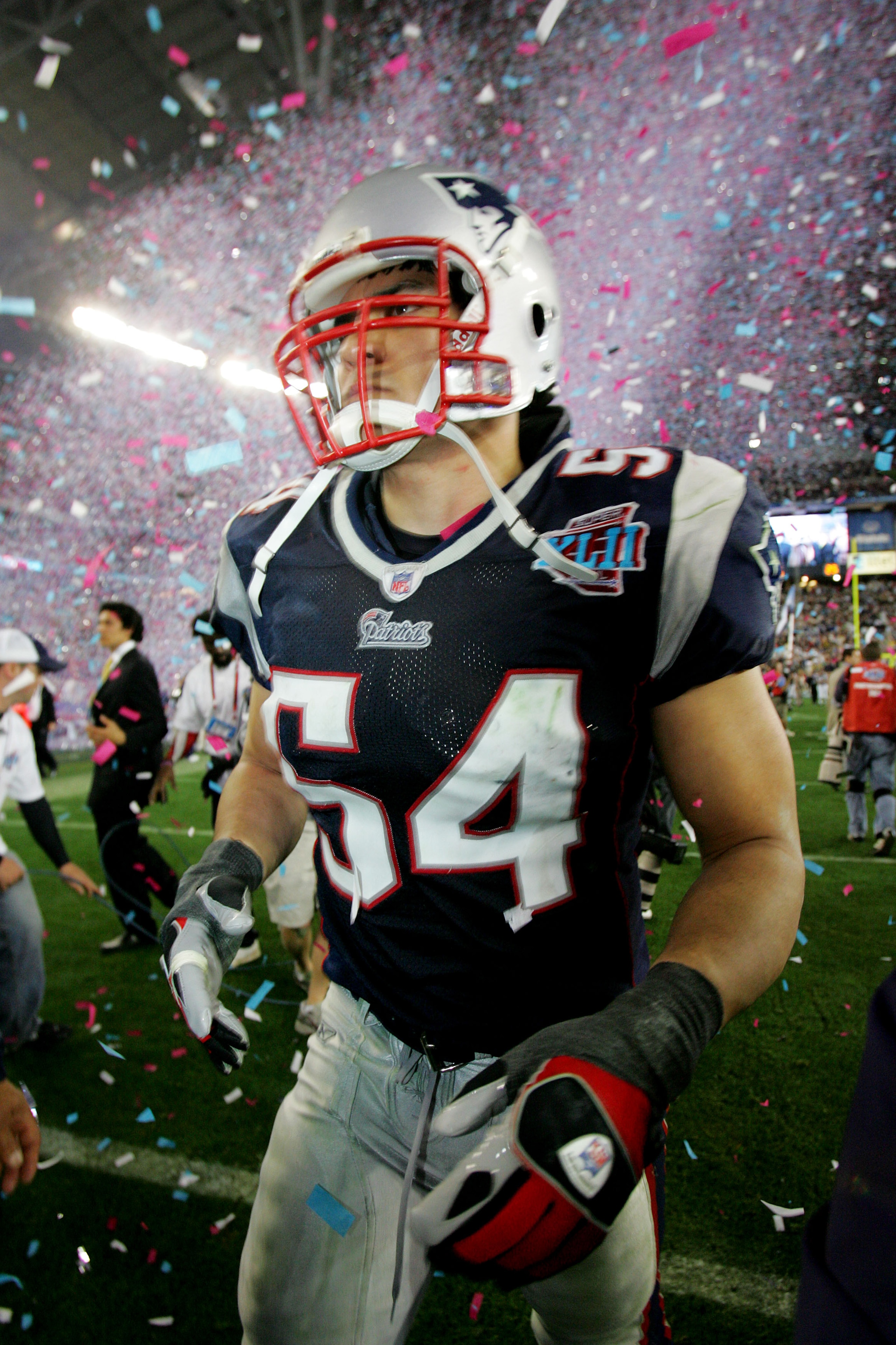 GLENDALE, AZ - FEBRUARY 03:  Tedy Bruschi  #54 of the New England Patriots walks off the field after losing to the New York Giants 17-14 in Super Bowl XLII on February 3, 2008 at the University of Phoenix Stadium in Glendale, Arizona.  (Photo by Streeter